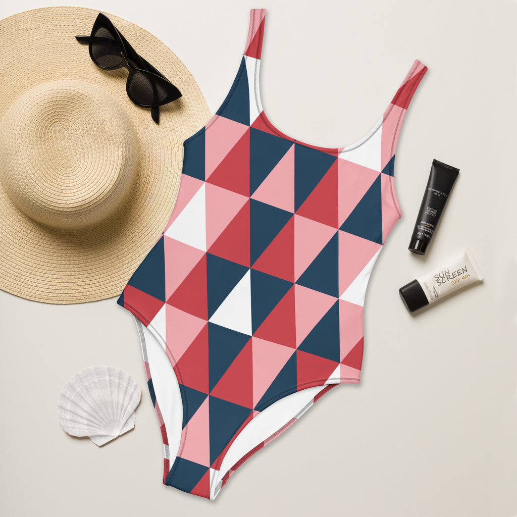 Women’s geometric colorblock buttery soft one-piece swimsuit with UPF 50 plus featuring pink navy and white triangles