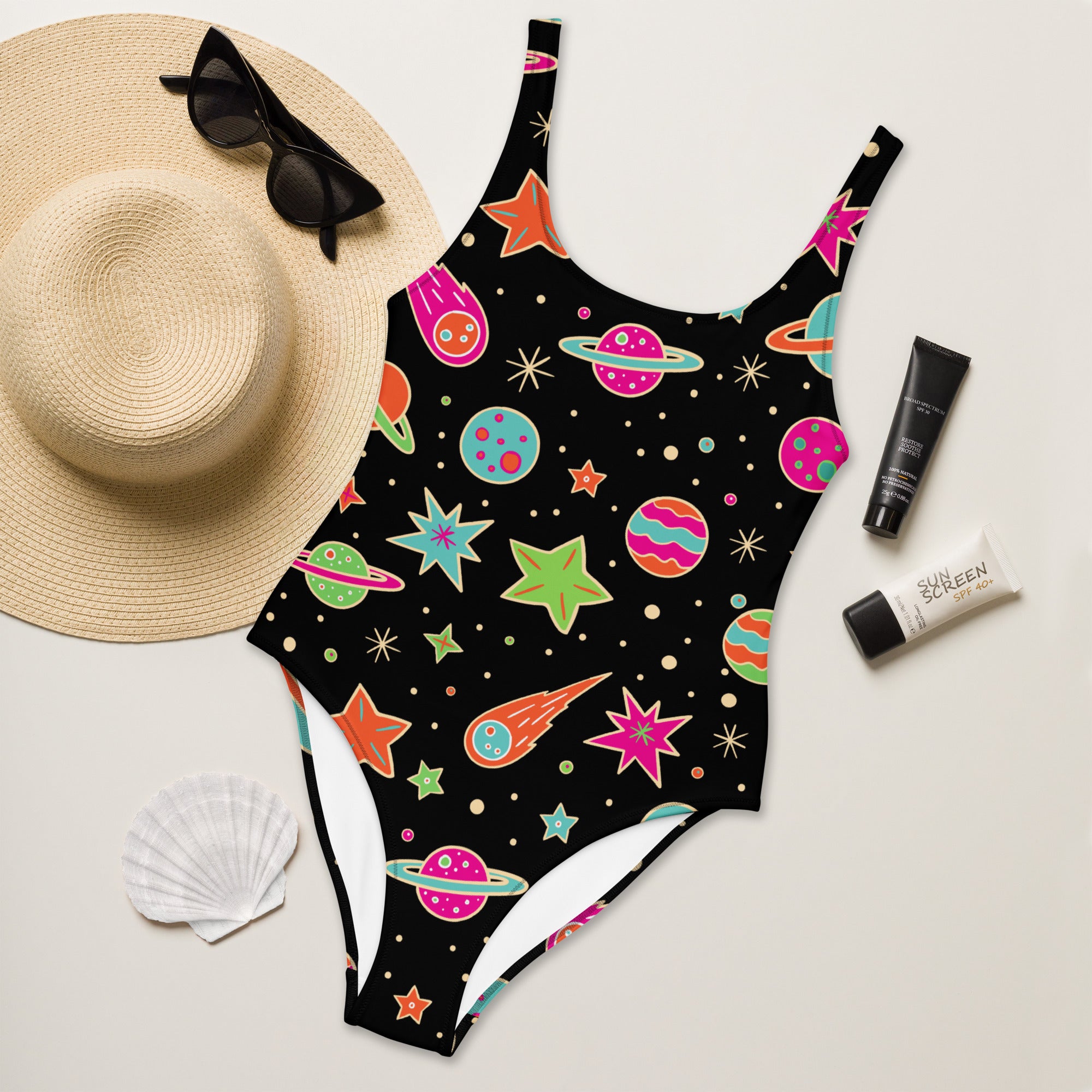 Women’s retro neon space buttery soft black one-piece swimsuit with vibrant colorful planets stars and UPF 50+ protection