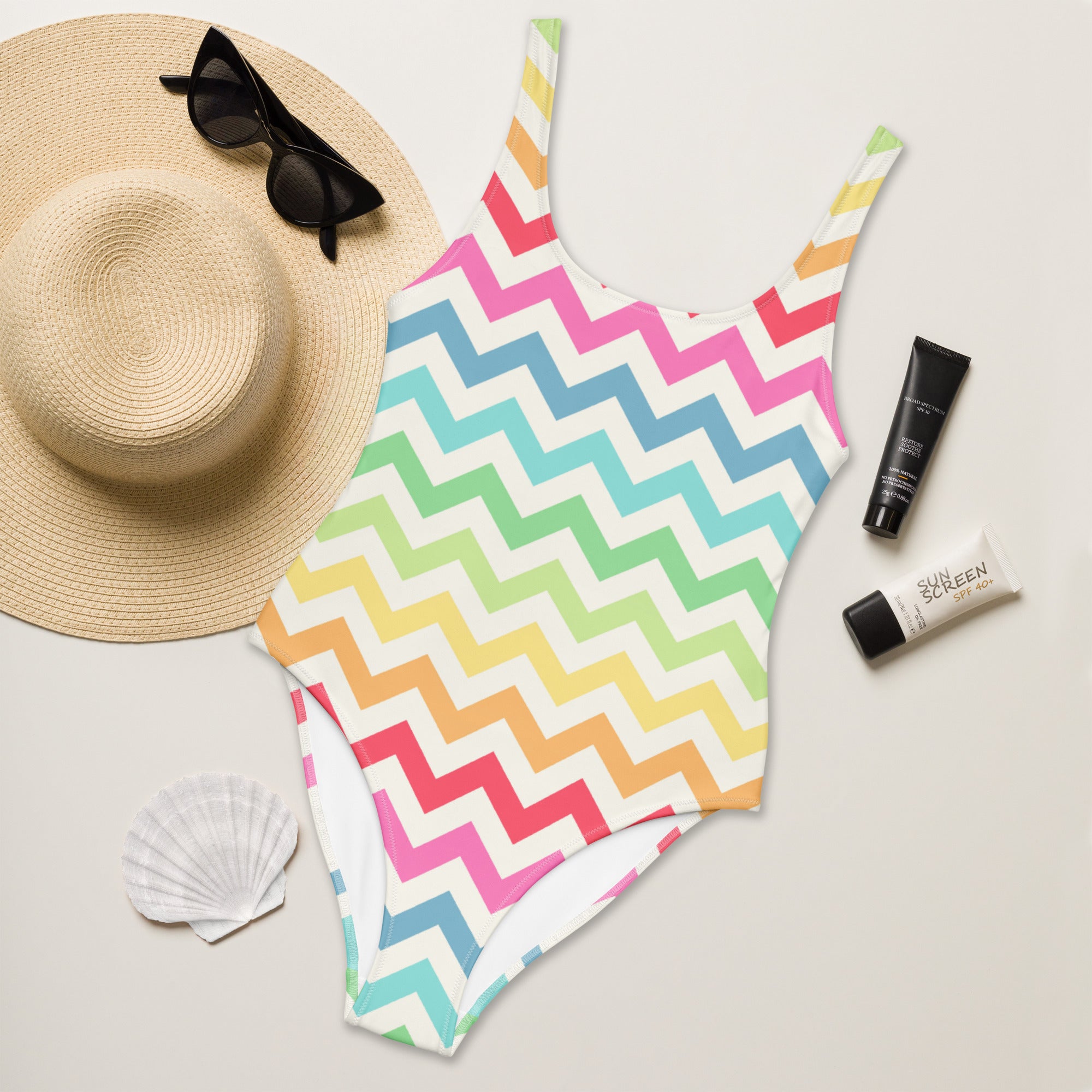 Women’s pastel rainbow chevron buttery soft one-piece swimsuit with thin straps white base and upf 50 plus protection