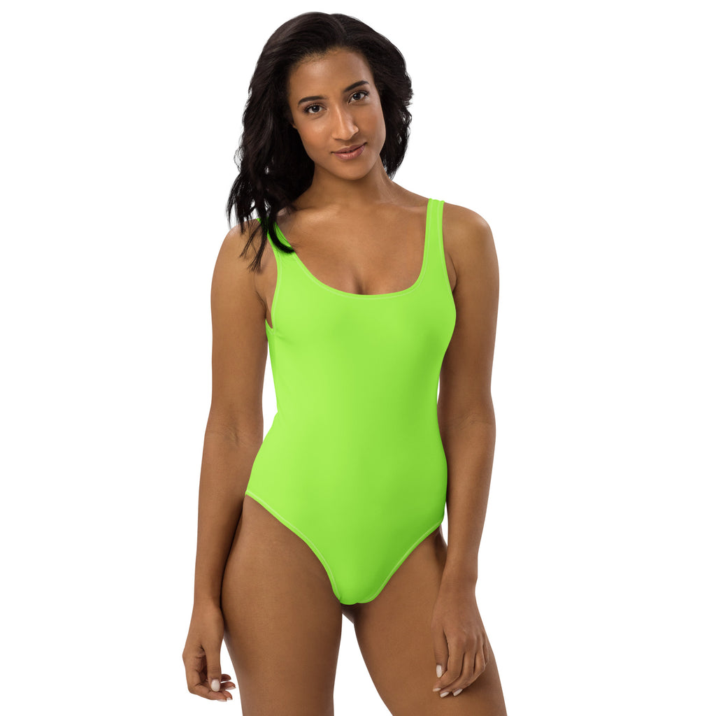 A vibrant neon green one-piece buttery soft swimsuit with thin straps square neckline and UPF 50 plus protection