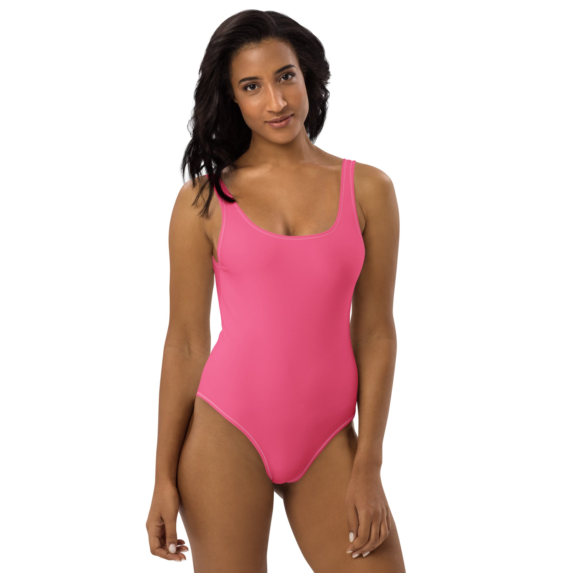 A vibrant pink buttery soft one-piece swimsuit with thin straps and upf 50 plus protection
