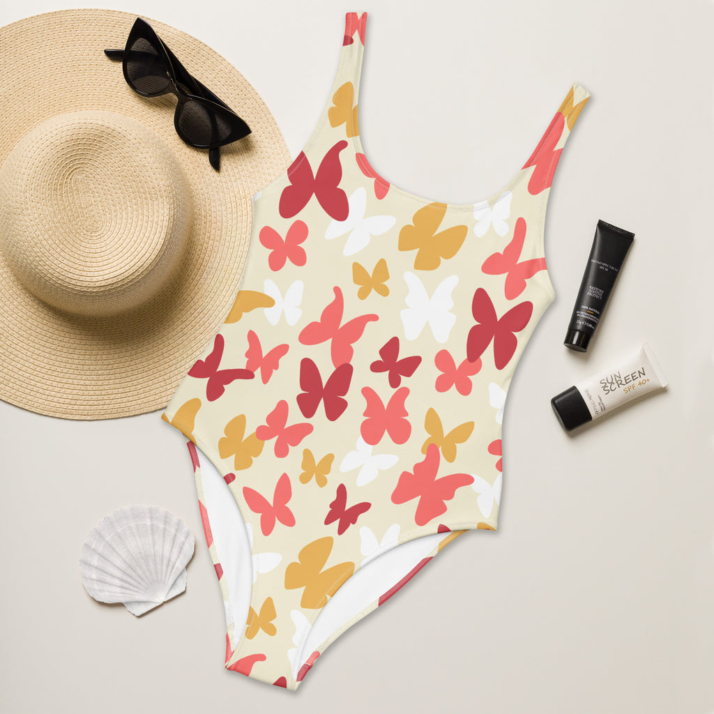 Women’s warm-tone buttery soft one-piece swimsuit with cream base butterfly pattern and UPF 50 plus sun protection