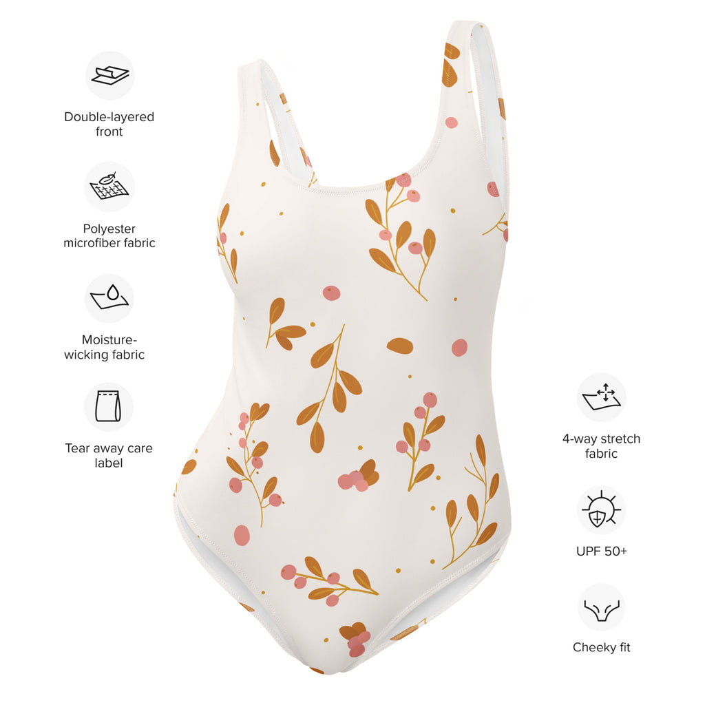 A white one-piece minimalist floral swimsuit with delicate brown leaves pink berries and buttery soft fabric with upf 50+