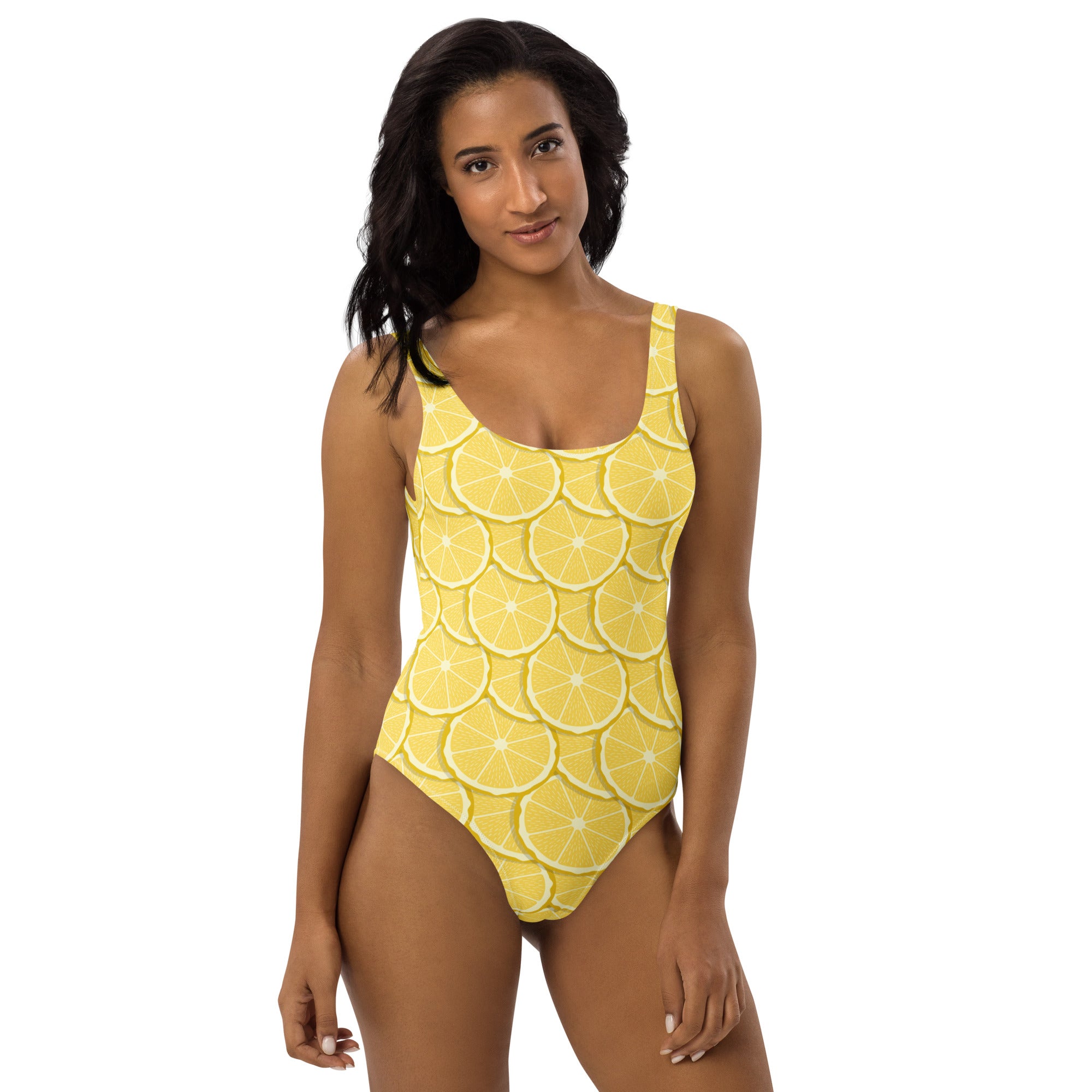 A vibrant yellow one-piece womens swimsuit with buttery soft fabric and a lemon slice pattern with UPF 50+ protection
