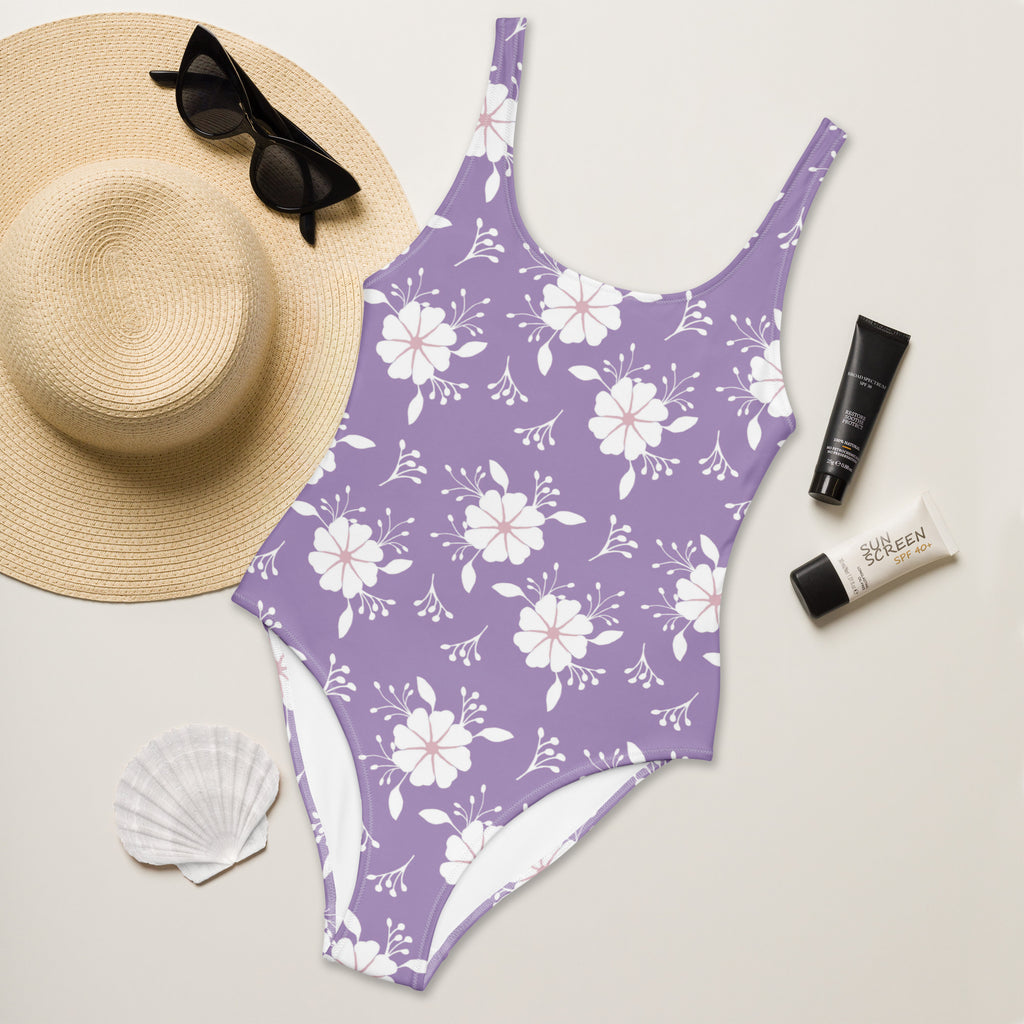 Lavender one-piece swimsuit with white floral pattern thin straps buttery soft fabric and UPF 50 plus protection