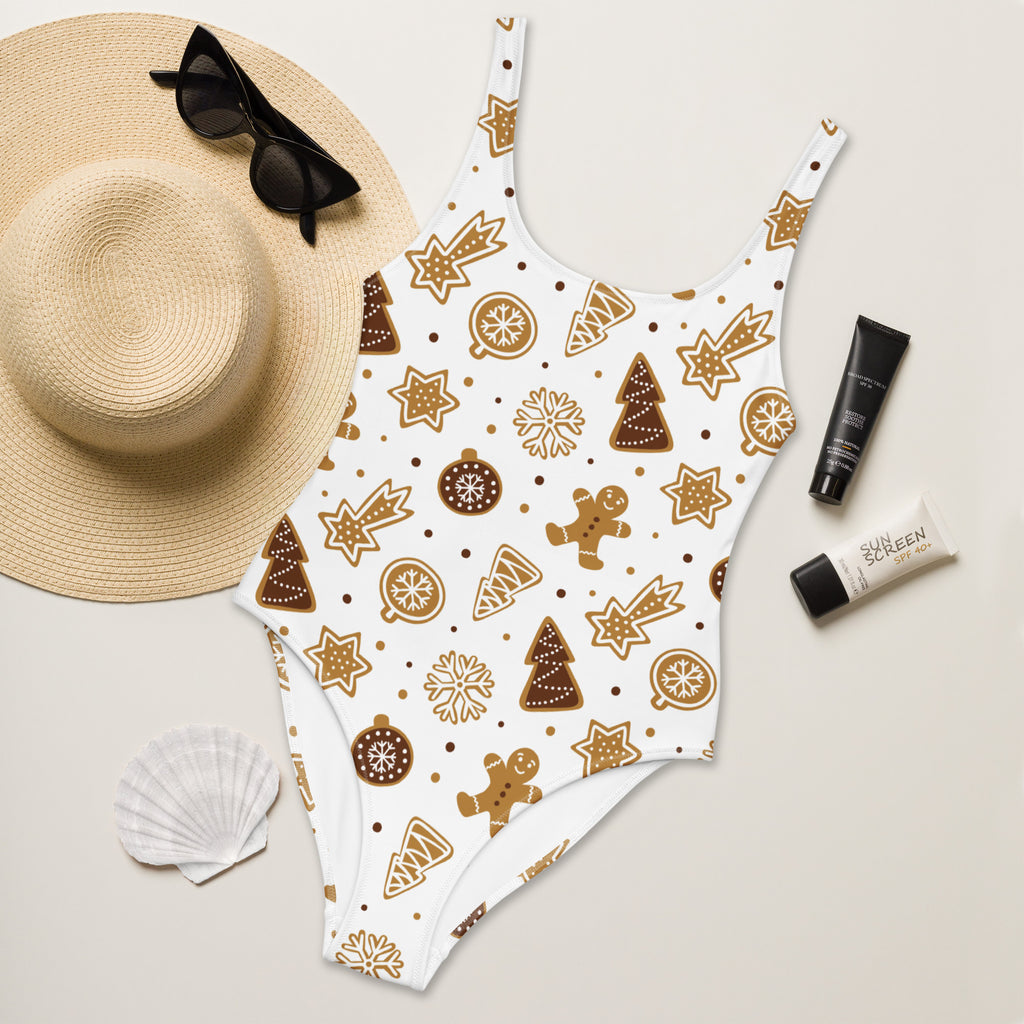 White one-piece swimsuit with gingerbread cookie pattern in brown and gold tones buttery soft fabric upf 50+ protection