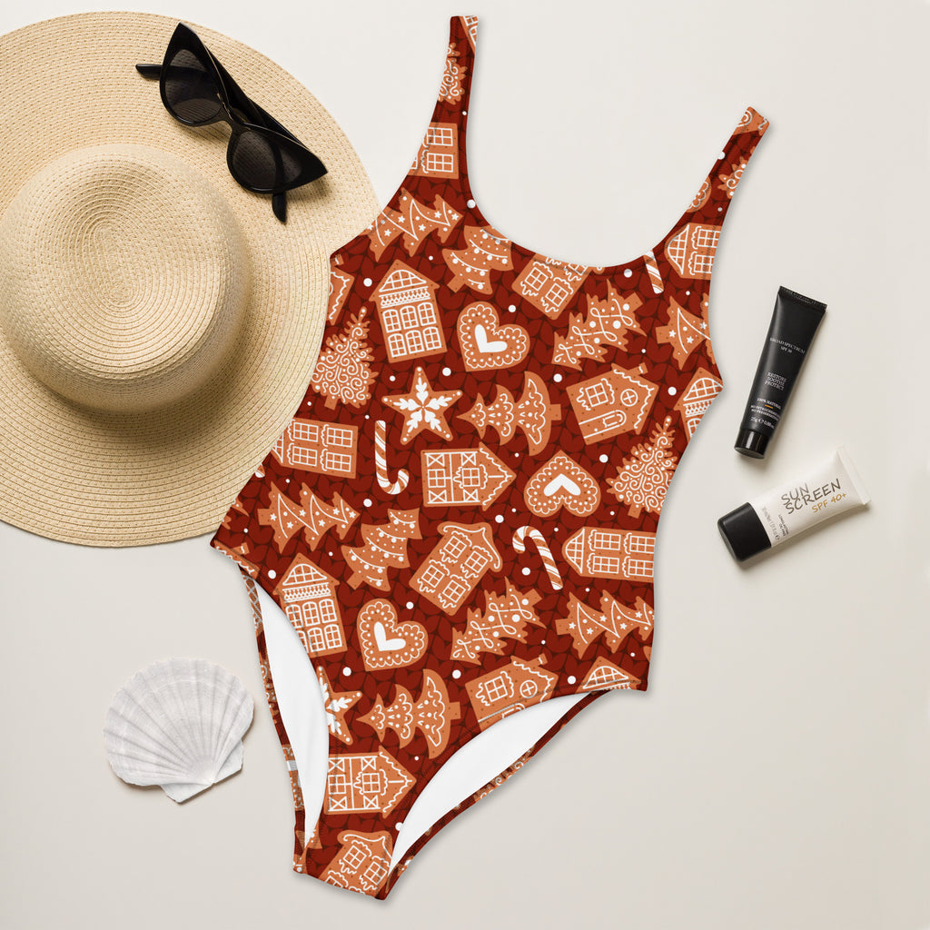 Women’s red gingerbread christmas buttery soft swimsuit with upf 50 plus featuring gingerbread houses candy canes and trees