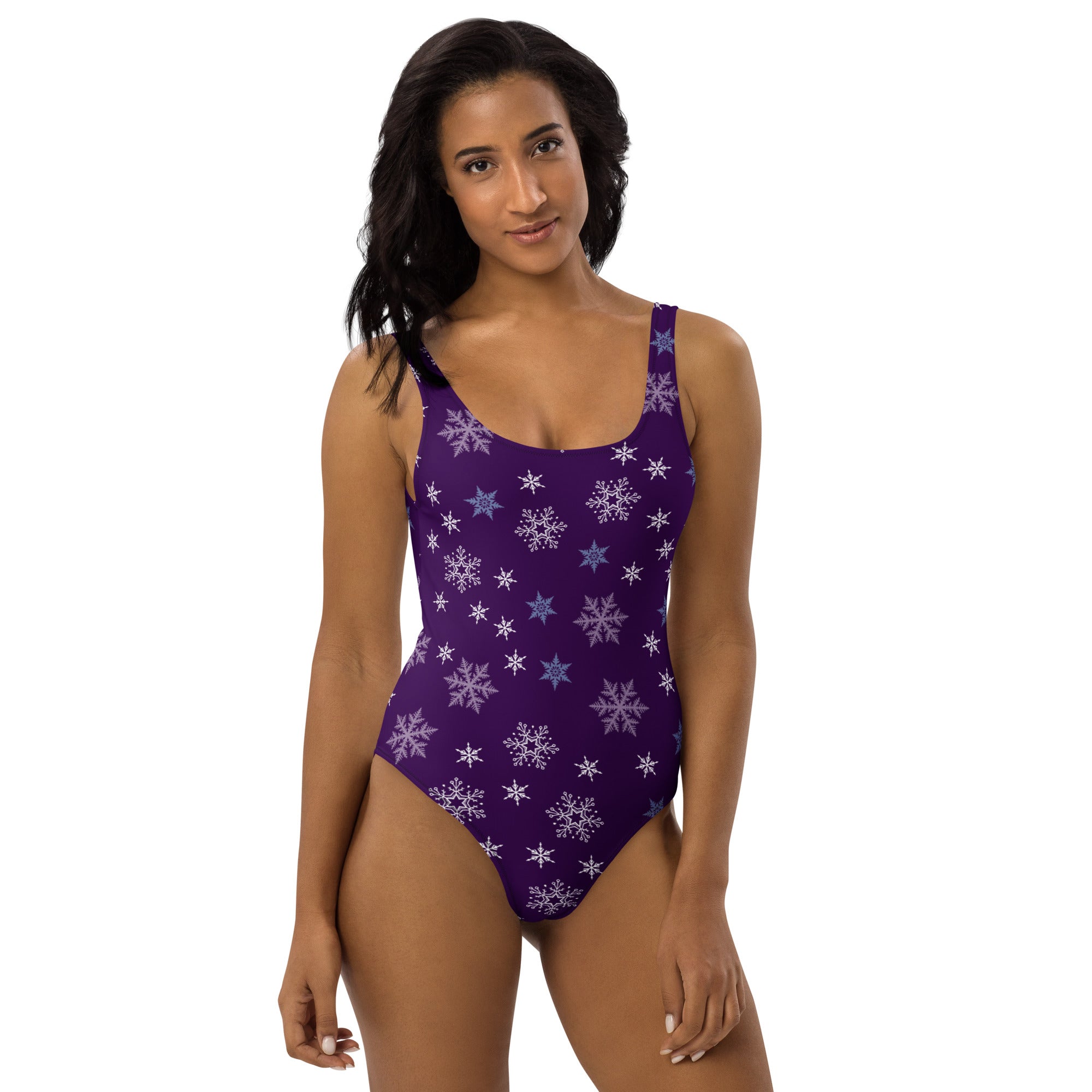 Women’s purple one-piece buttery soft swimsuit with white and light blue snowflake pattern and UPF 50 plus protection