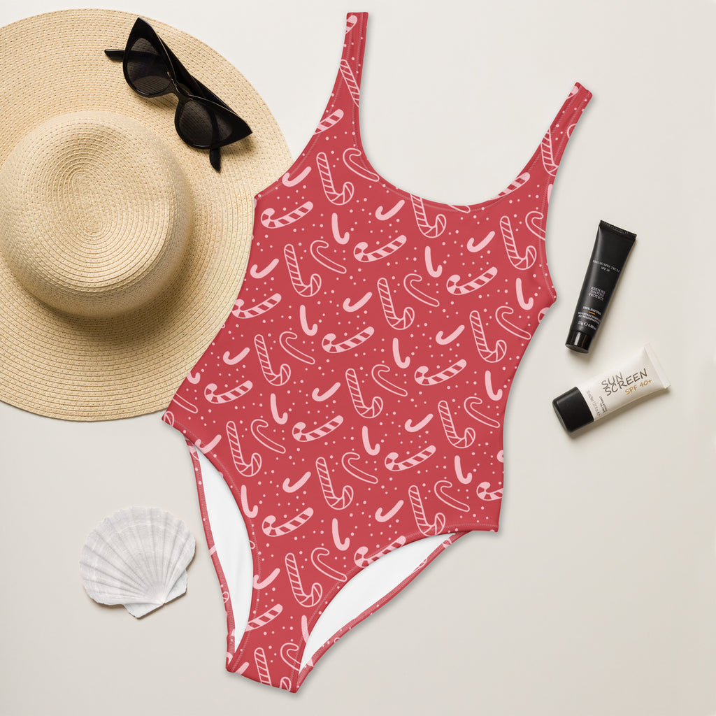 Women’s red candy cane one-piece swimsuit with white dotted pattern buttery soft fabric and upf 50+ protection