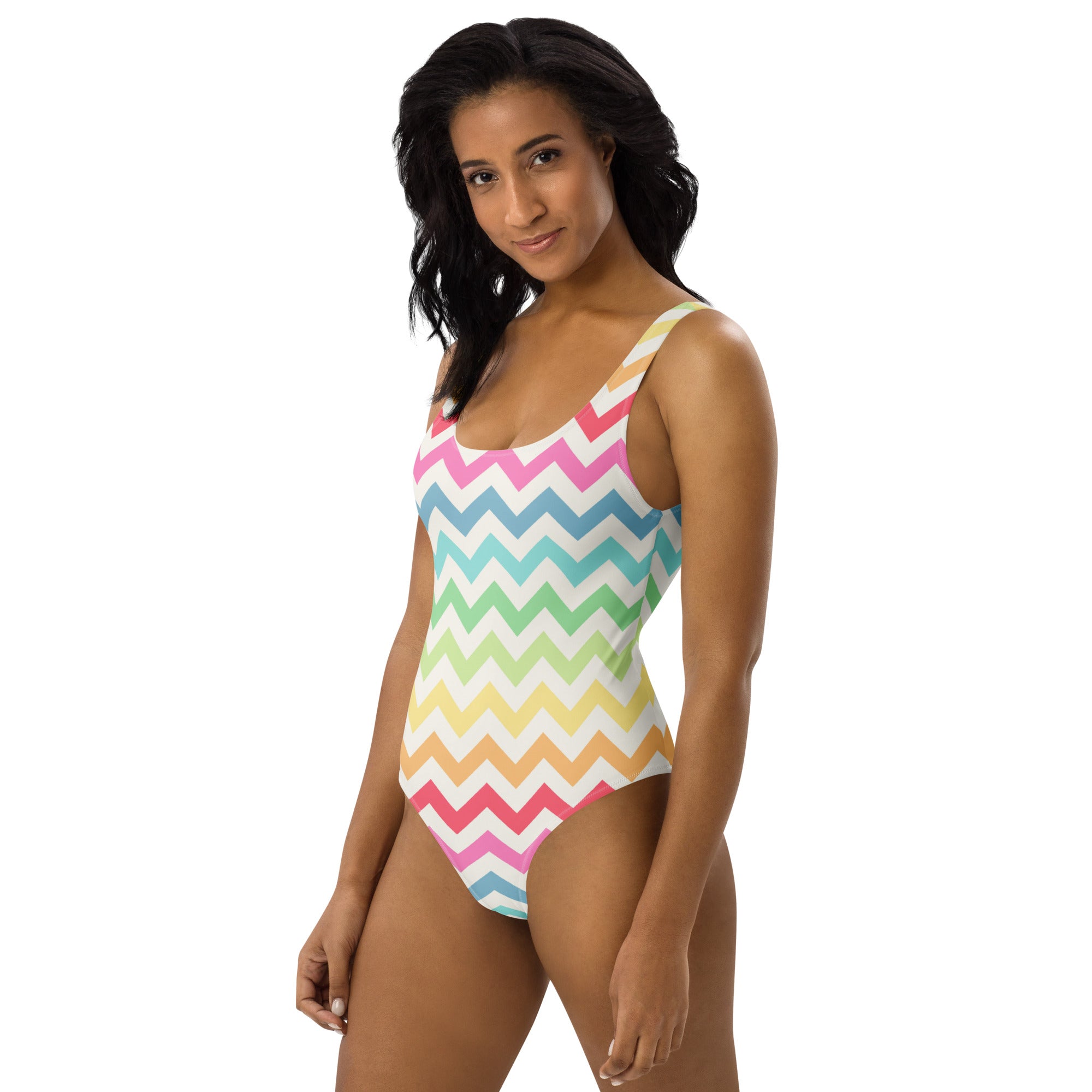 A vibrant pastel rainbow chevron one-piece swimsuit with thin straps and buttery soft fabric with UPF 50 plus protection