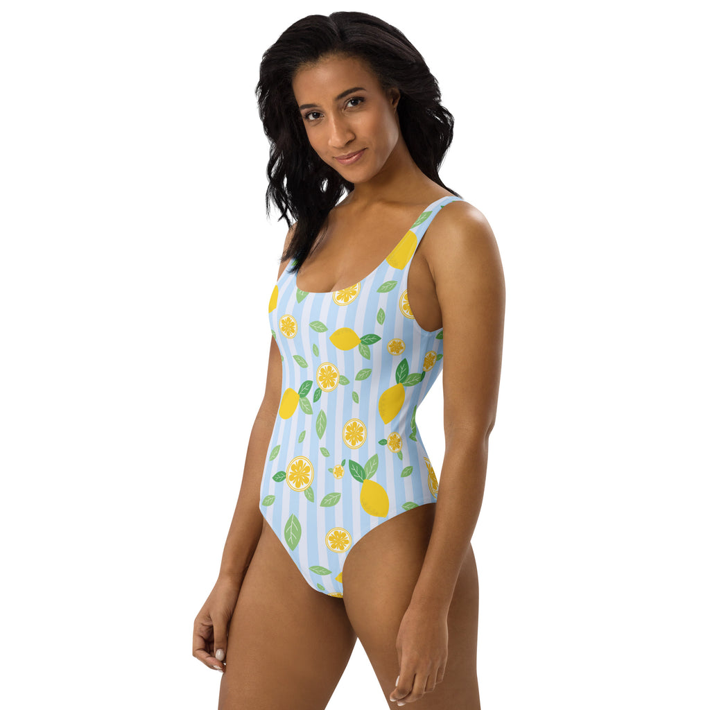 Women’s blue lemon stripe buttery soft one-piece swimsuit with upf 50plus featuring yellow lemons and green leaves