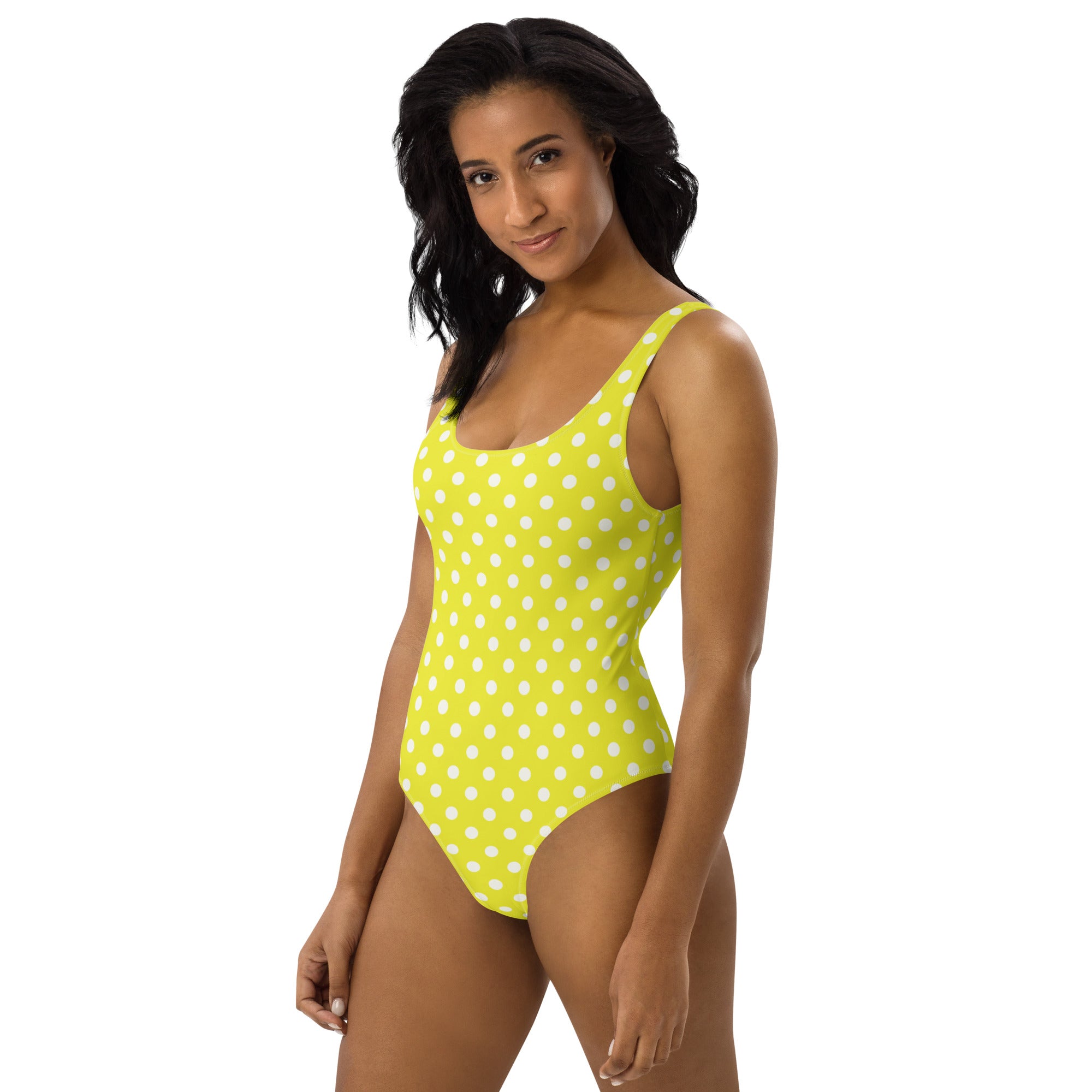 A vibrant lime green one-piece swimsuit with white polka dots featuring buttery soft fabric and UPF 50 plus protection