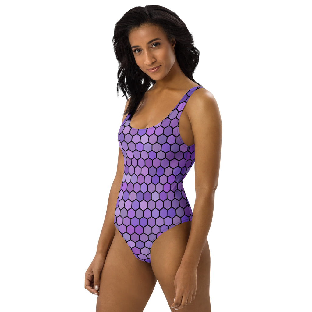 Women’s one-piece purple honeycomb swimsuit with bold black hexagonal pattern buttery soft fabric upf 50+
