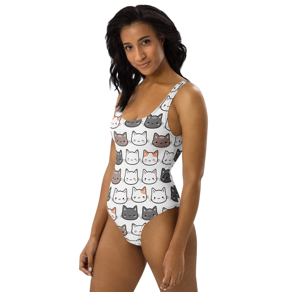 White women’s one-piece cat buttery soft swimsuit with colorful cartoon cat faces and UPF 50+ sun protection