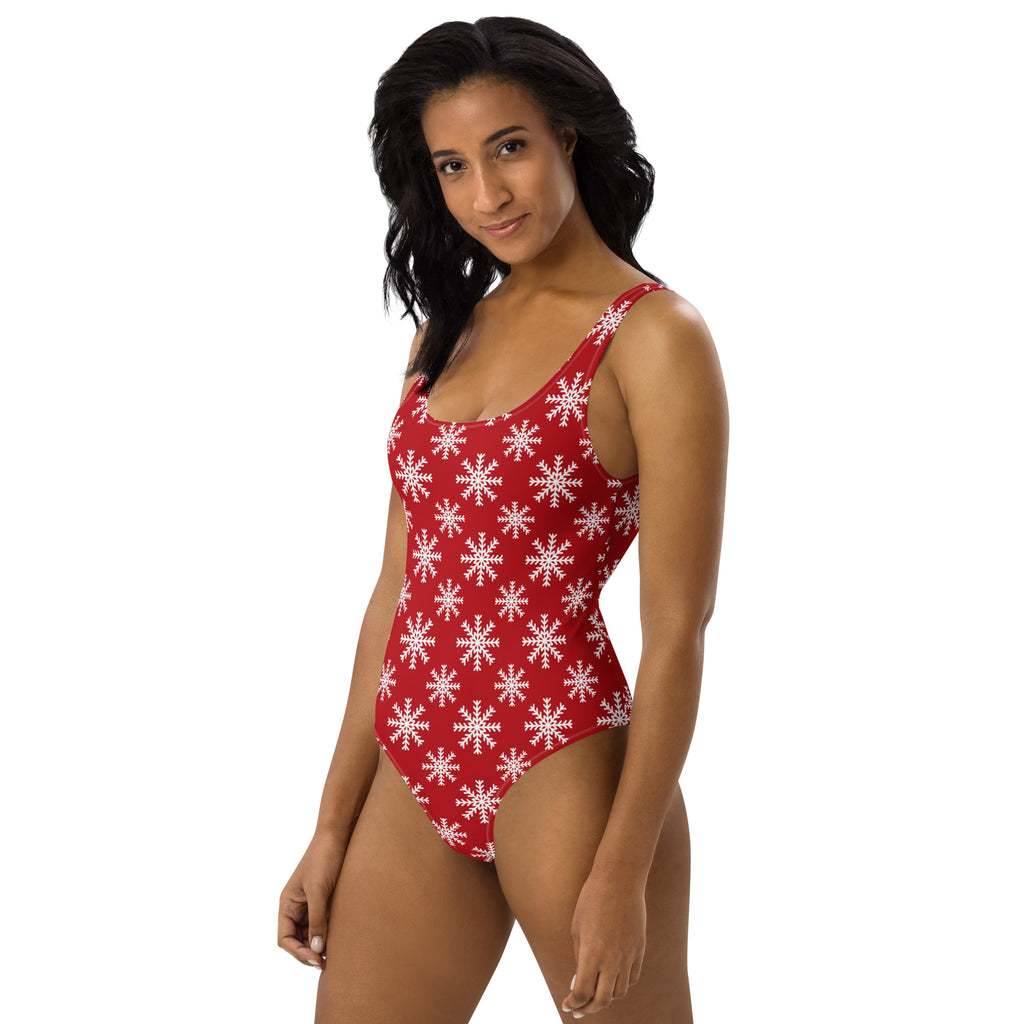 Women’s red one-piece buttery soft swimsuit with white snowflake pattern and UPF 50 plus for Christmas use