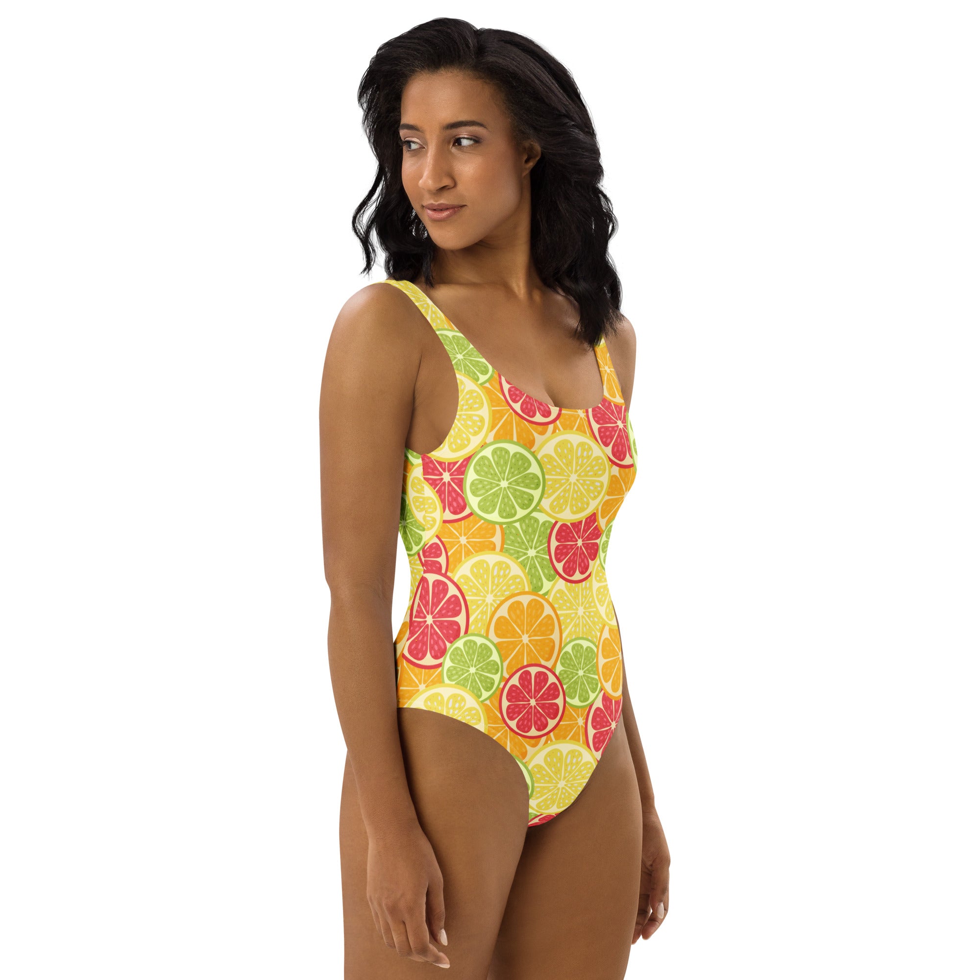 A vibrant yellow women’s citrus fruit slices buttery soft swimsuit with upf 50 plus and colorful sliced citrus pattern