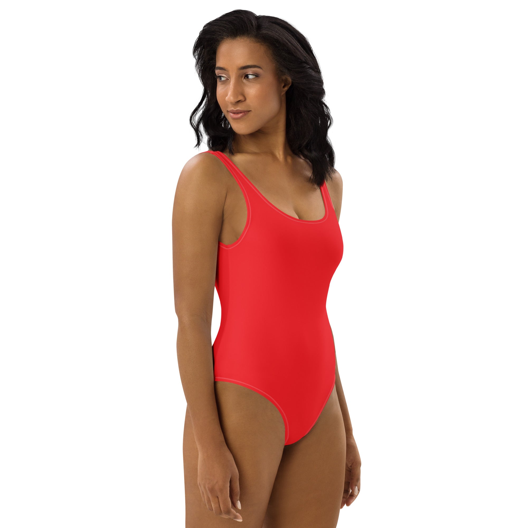 A vibrant red one-piece buttery soft swimsuit with thin straps scoop neckline and UPF 50 plus sun protection