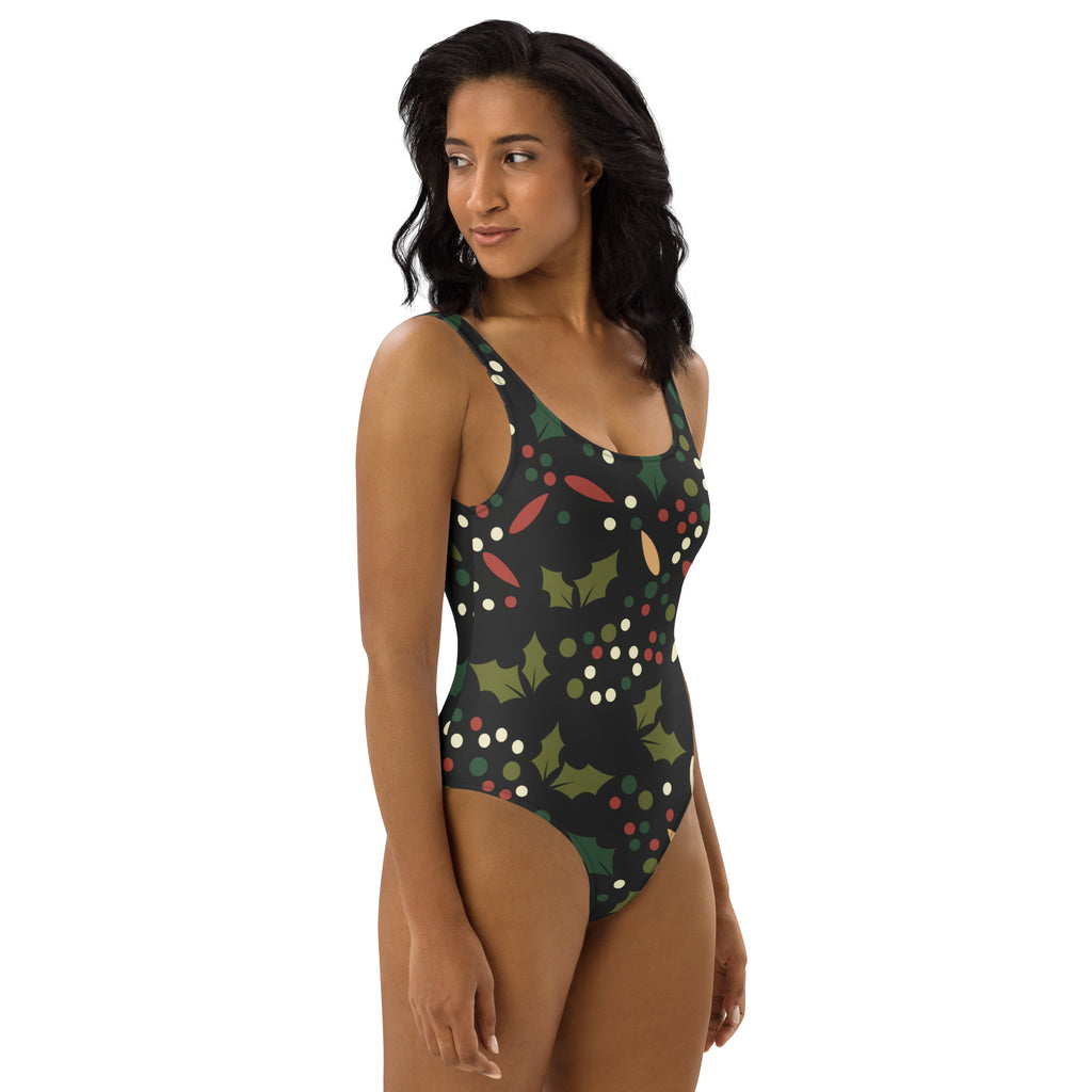 Women’s dark green holly berry christmas buttery soft one-piece swimsuit with festive pattern and upf 50 plus protection