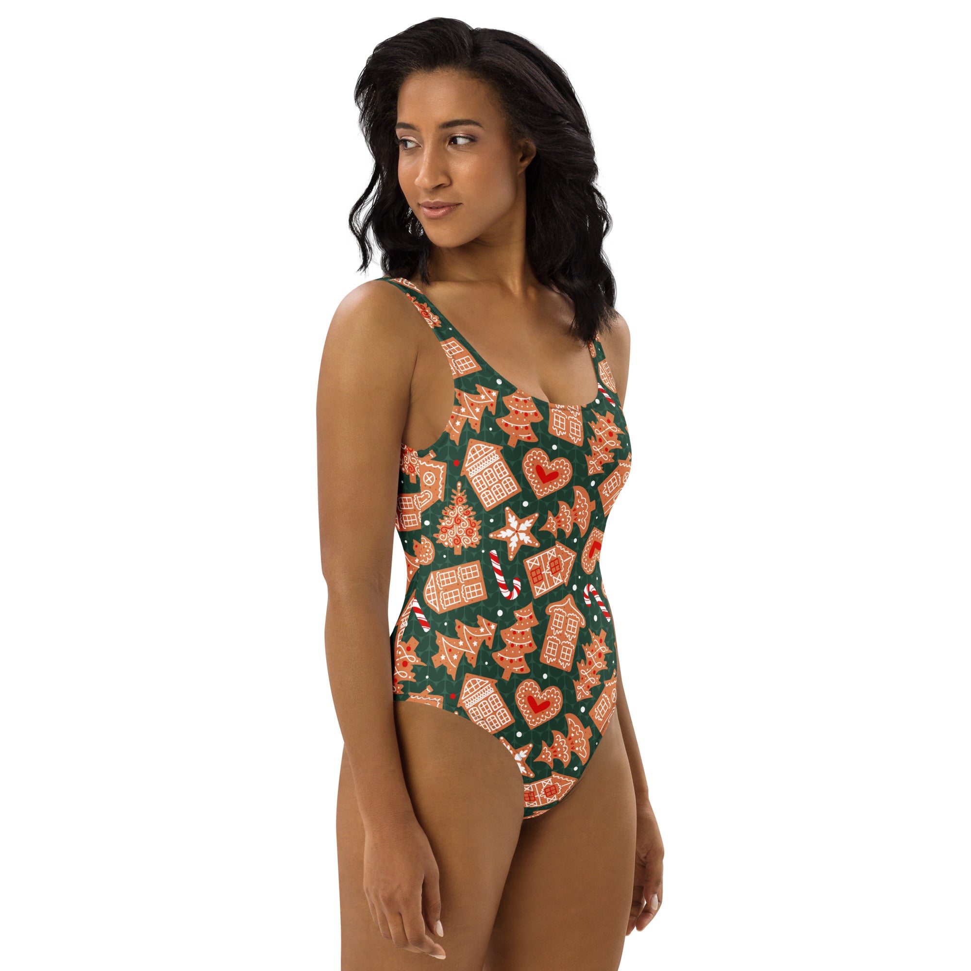 Women’s green gingerbread christmas buttery soft swimsuit with UPF 50 and holiday candy cane and gingerbread patterns