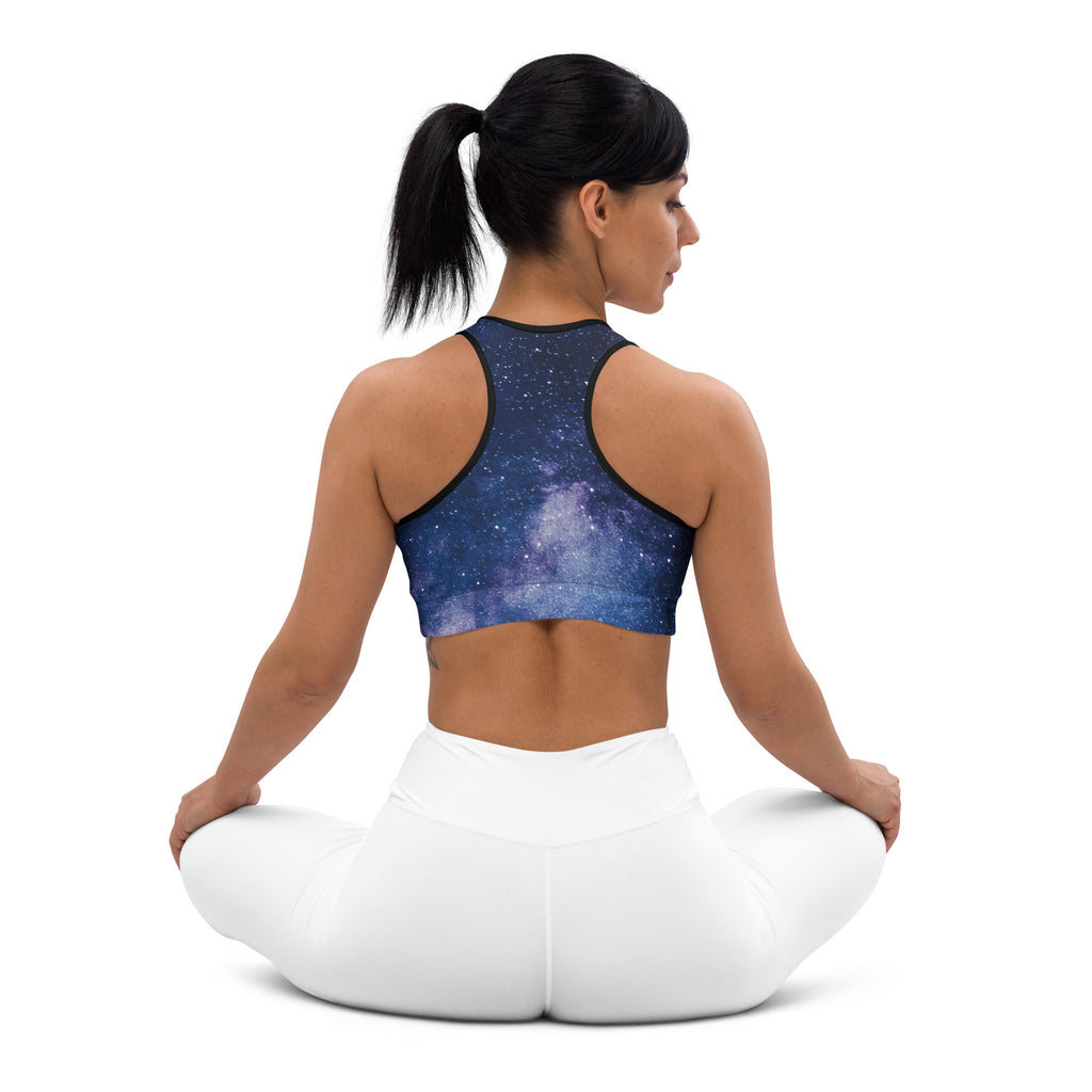 Blue galaxy-print padded sports bra with black trim featuring buttery soft fabric and quick-dry support for women