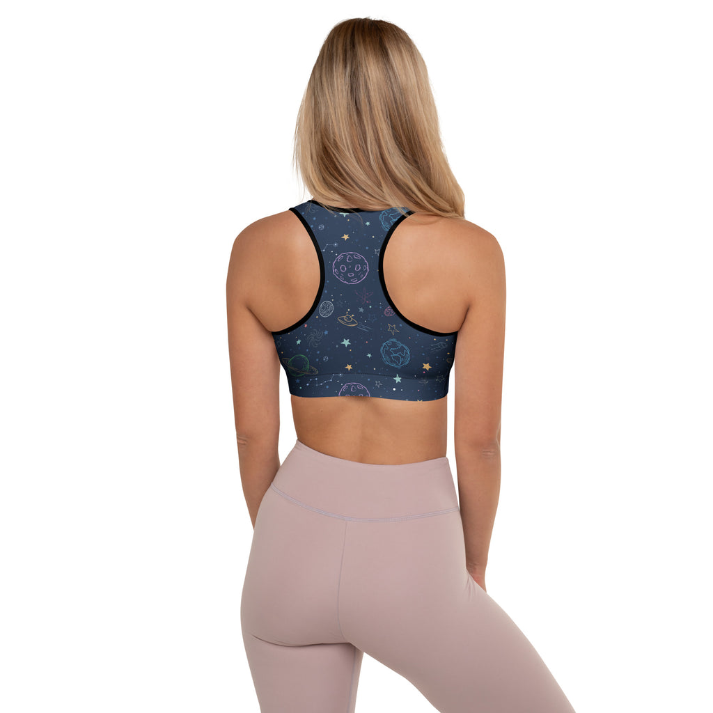 Dark blue space-themed women’s padded sports bra with celestial patterns black trim buttery soft supportive quick-dry