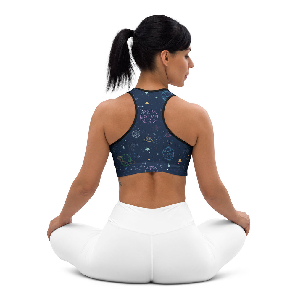 Dark blue space-themed women’s padded sports bra with celestial patterns, black trim, buttery soft and quick-dry fabric