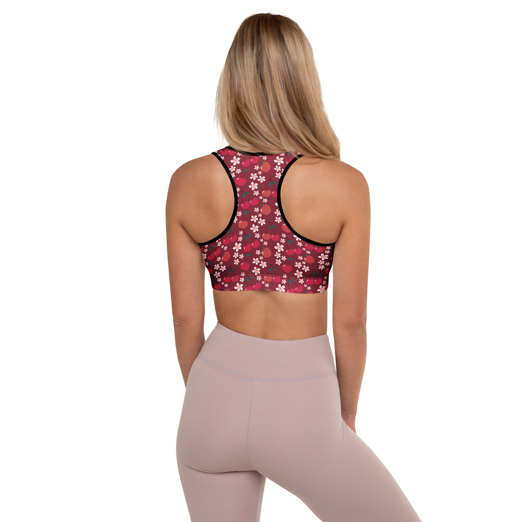 Women’s burgundy cherry blossom padded sports bra with pink and white floral pattern black trim quick-dry and supportive