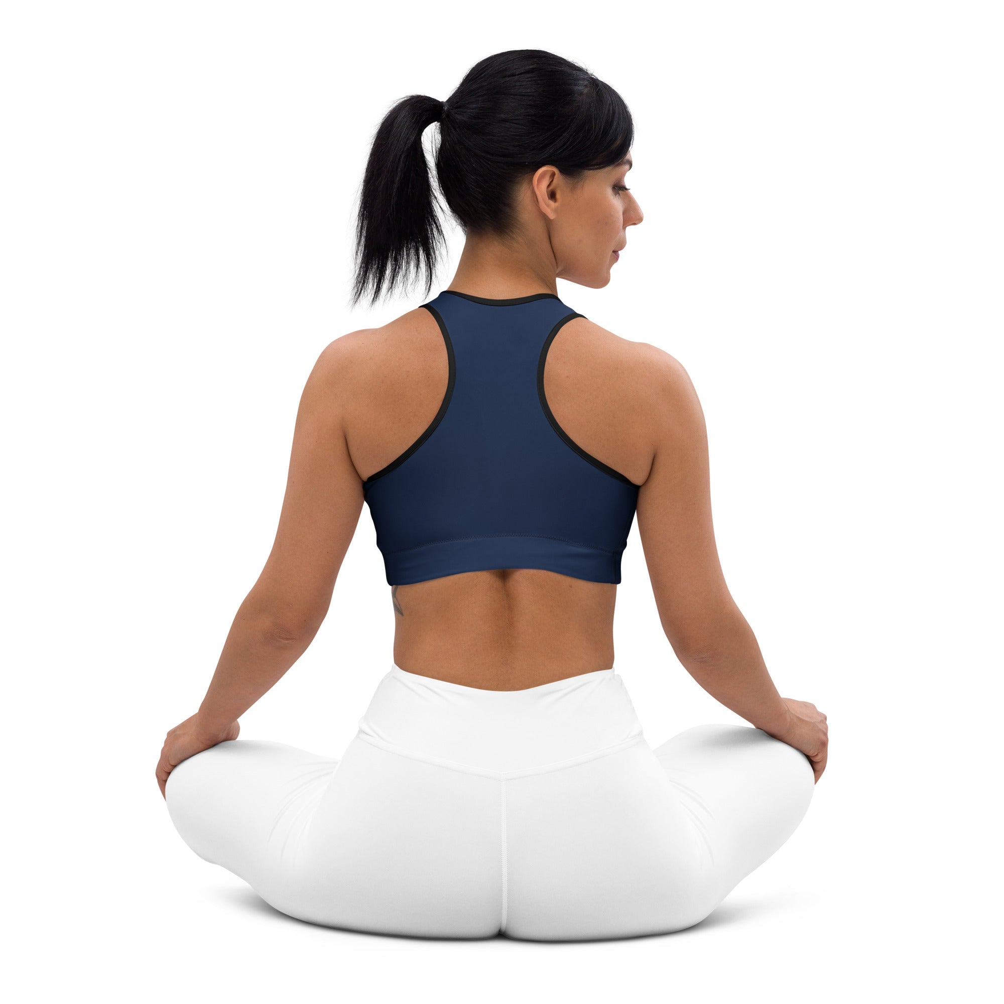 Women’s navy padded sports bra with black trim, buttery soft fabric, supportive fit, and quick-dry material