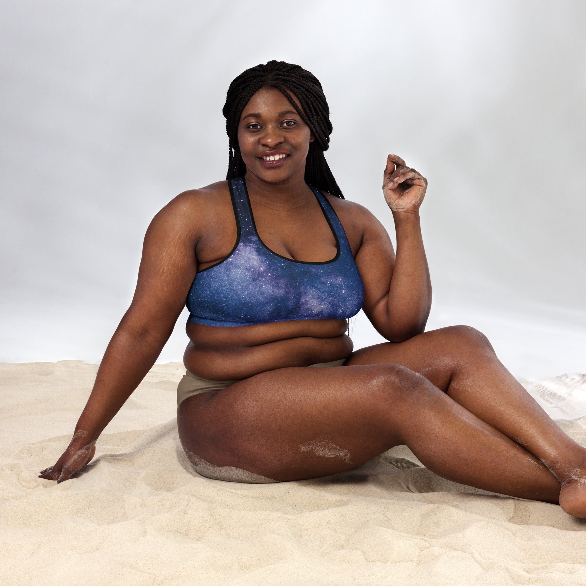 Women’s blue galaxy-patterned padded sports bra with black trim buttery soft supportive and quick-dry material