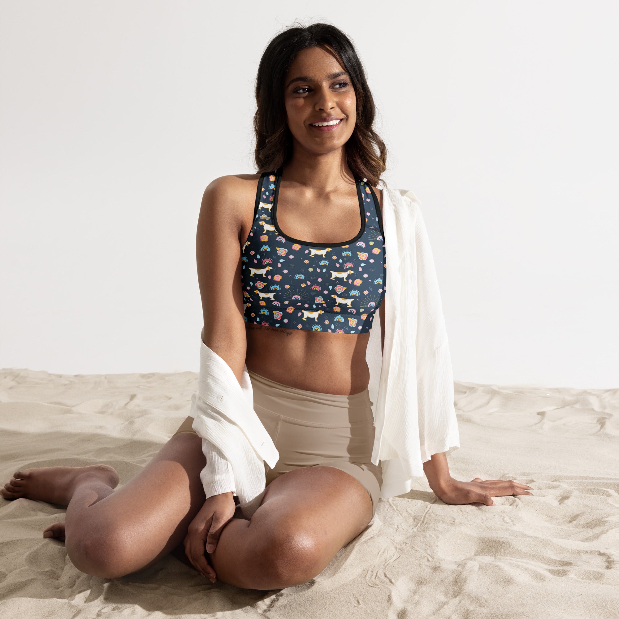 Navy blue padded sports bra with white dachshunds rainbows and colorful paw prints buttery soft quick dry