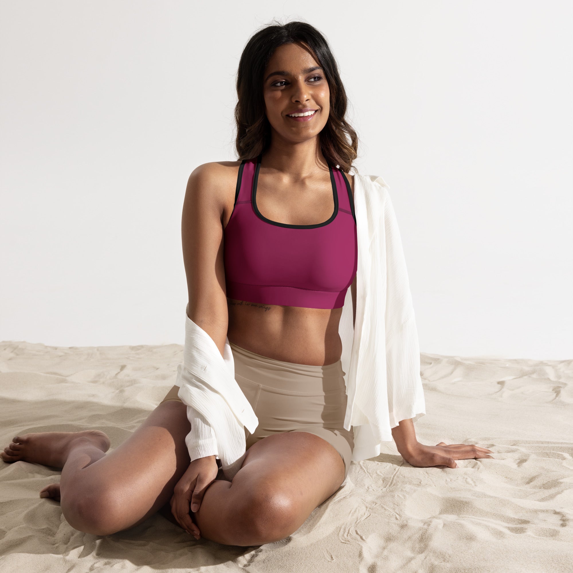 Women’s burgundy padded sports bra in magenta with black trim buttery soft supportive and quick-dry material