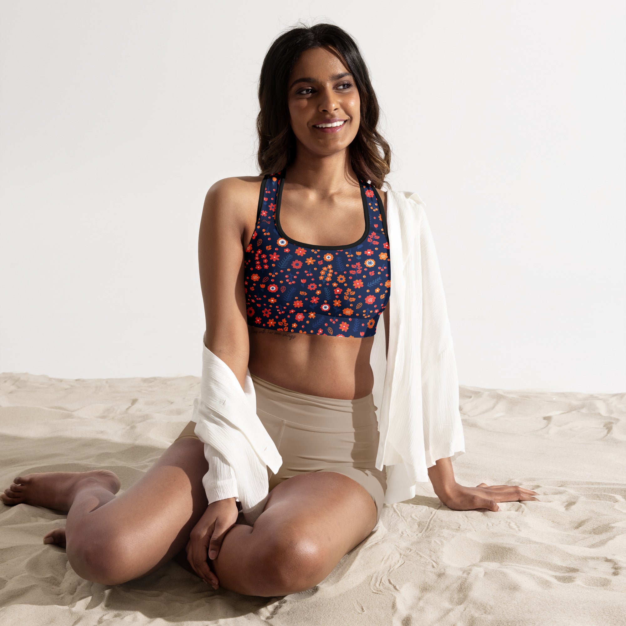 Women’s navy floral padded sports bra with red and orange blossoms buttery soft supportive and quick-dry material