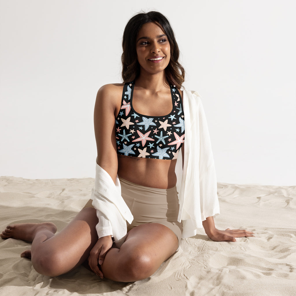 Black women’s starfish print padded sports bra with pastel pink and light blue pattern, buttery soft and quick-dry