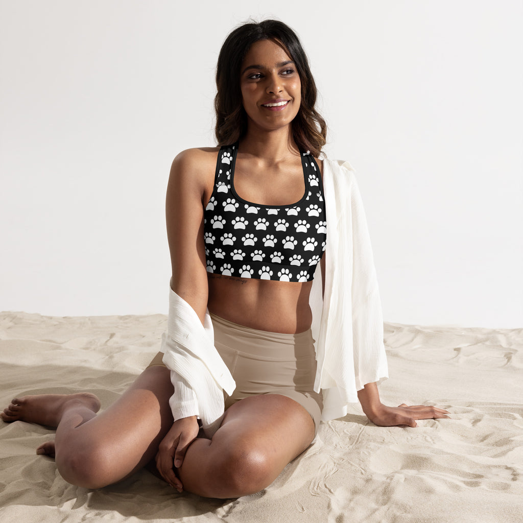 Women’s black padded sports bra with white paw print pattern buttry soft supportive and quick-dry material