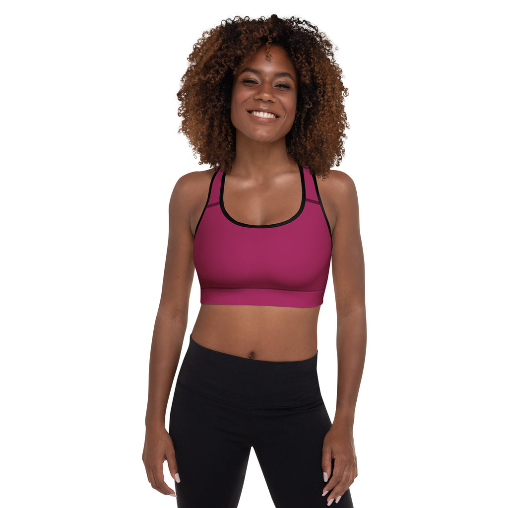 Women’s burgundy padded sports bra in vibrant magenta with black trim featuring a buttery soft seamless design