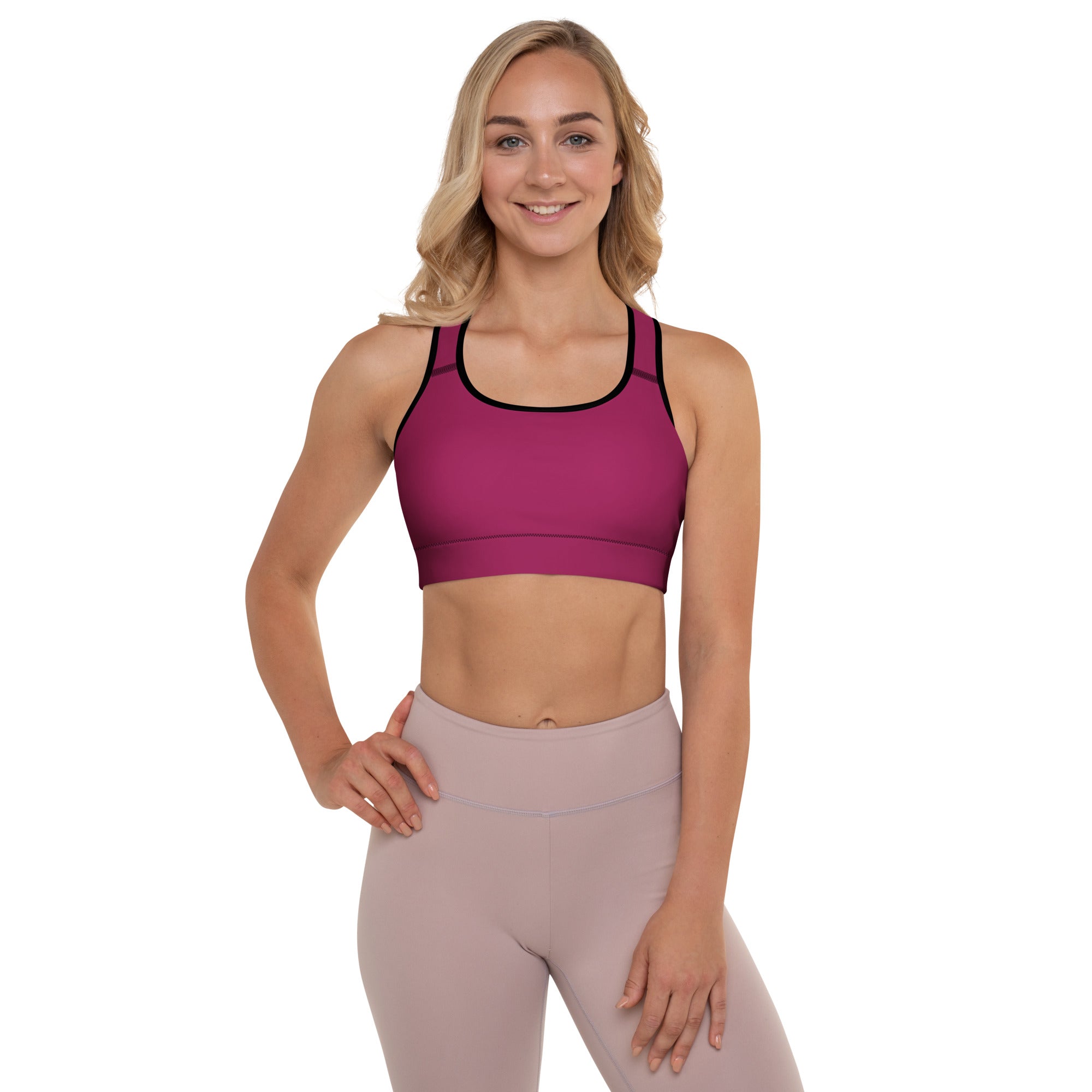 Women’s burgundy padded sports bra with magenta color, black trim, buttery soft fabric, and racerback design
