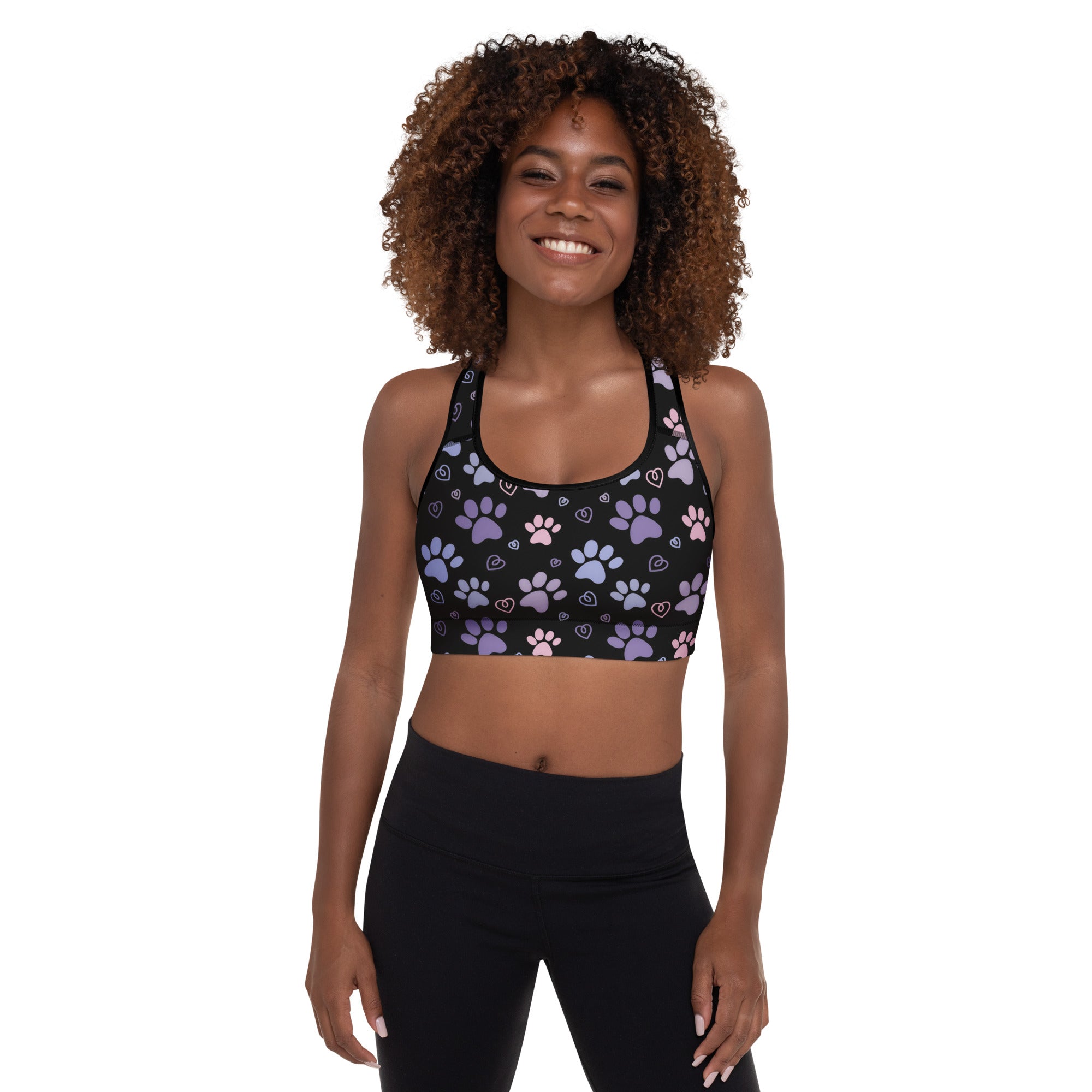 Black women’s padded sports bra with purple and pink paw prints and white hearts buttery soft quick dry