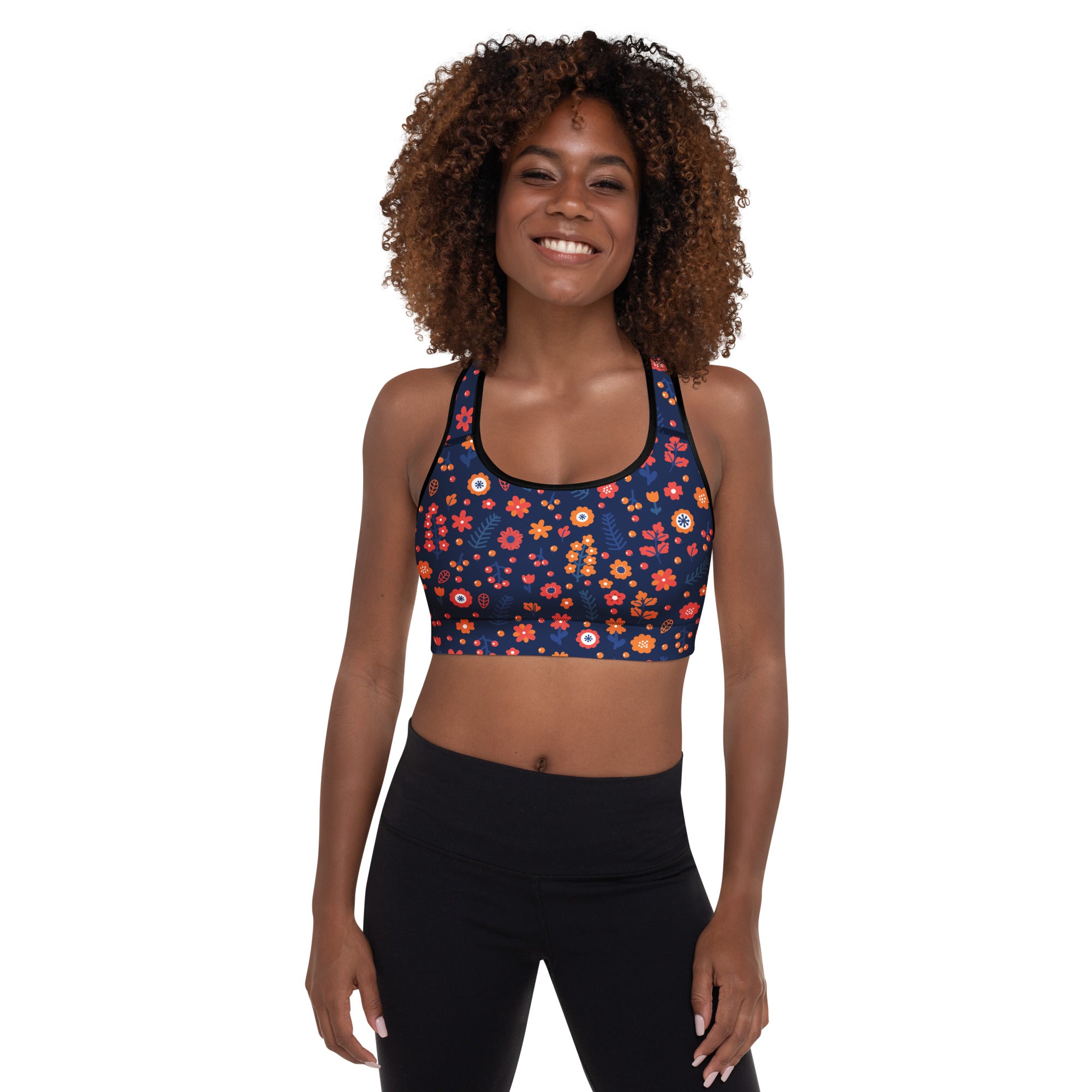 Women’s navy floral padded sports bra with vibrant orange pink and yellow blossoms buttery soft supportive and quick dry