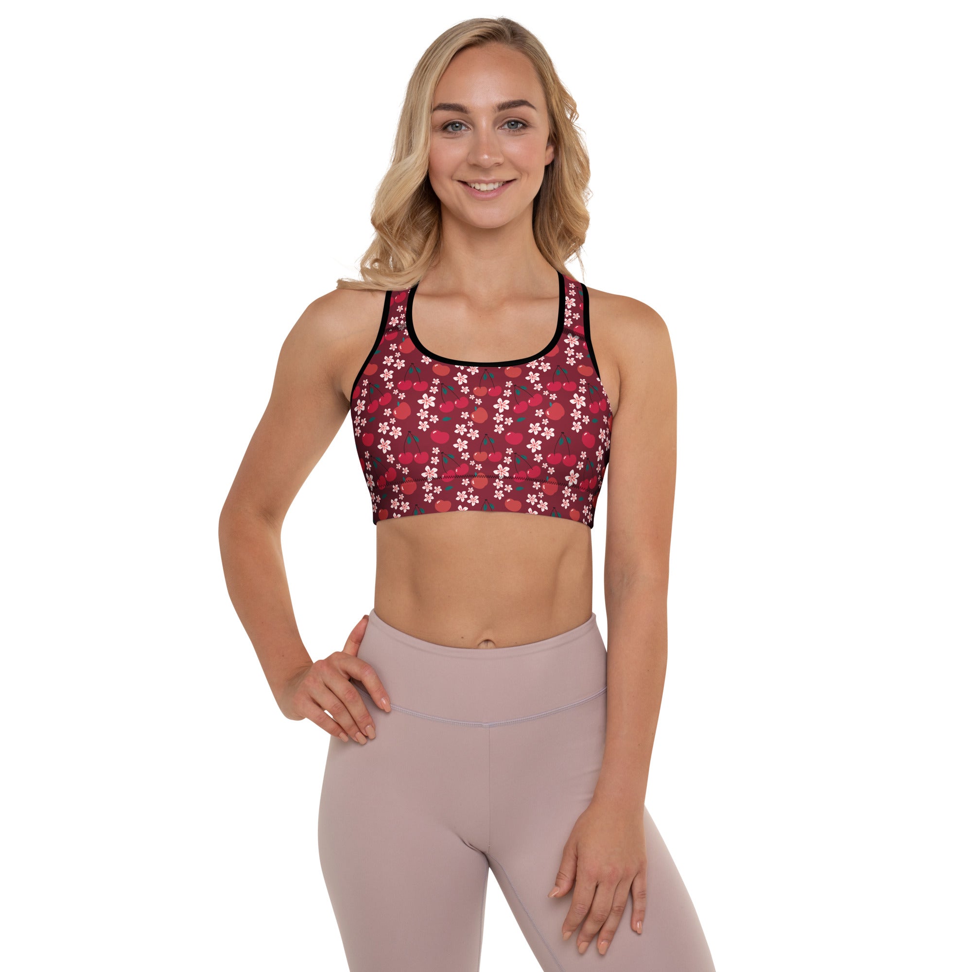 Women’s burgundy padded sports bra with white floral pattern black trim buttery soft supportive and quick dry