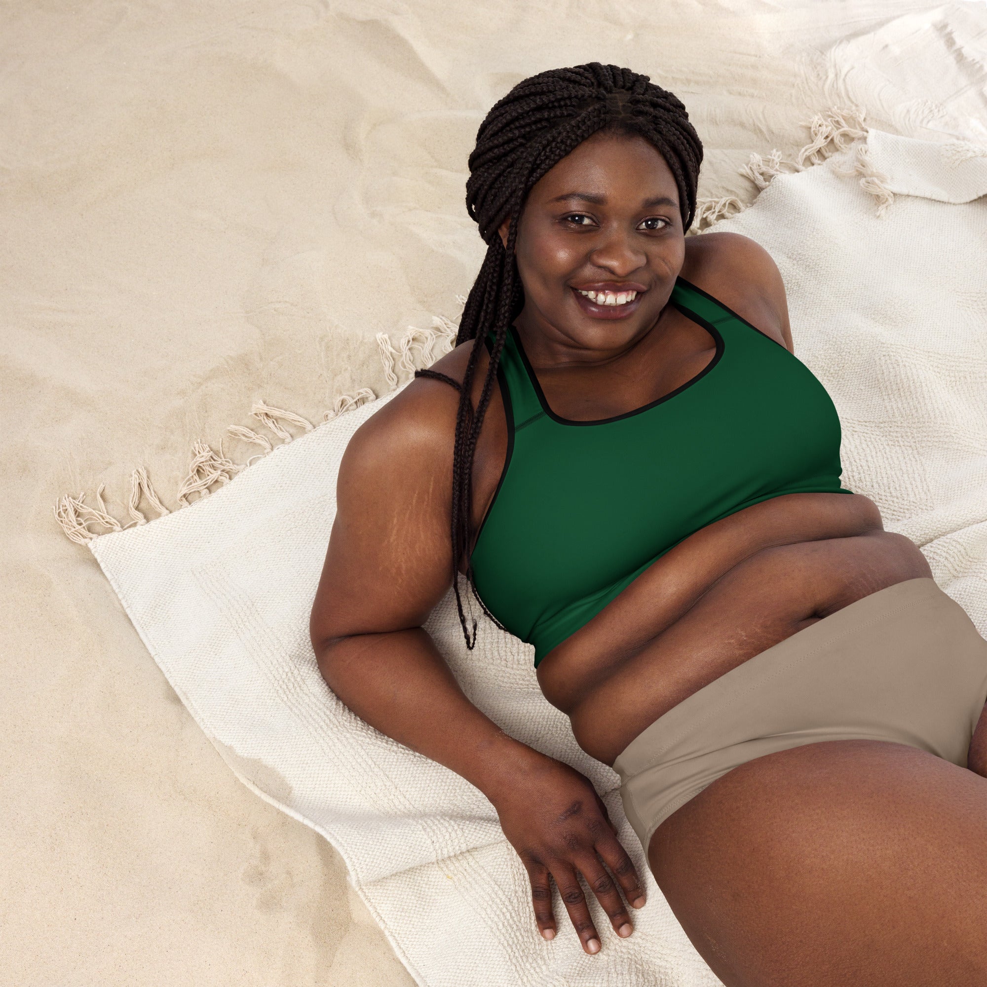 Women’s dark green padded sports bra with black trim features buttery soft, supportive, and quick-dry fabric