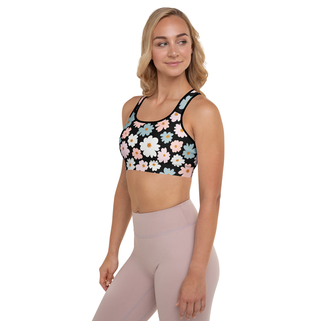 Black women’s retro floral padded sports bra with vibrant white pink and light blue daisies buttery soft and quick dry
