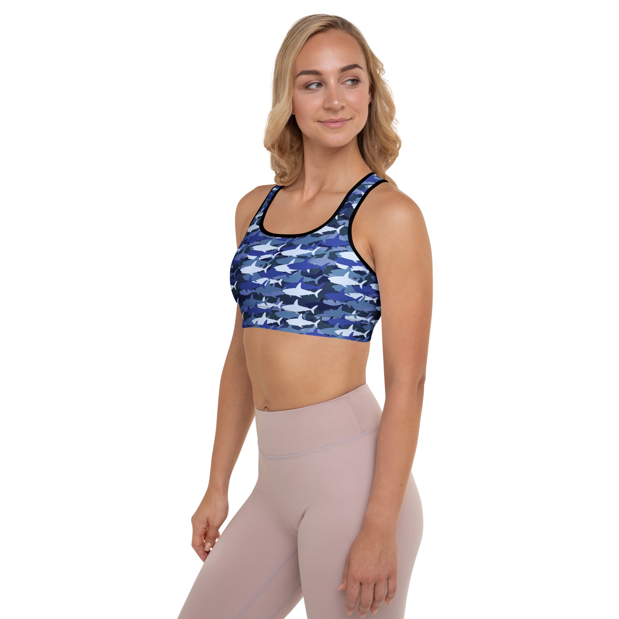 Women’s blue and white shark patterned padded sports bra with black trim buttery soft supportive and quick dry