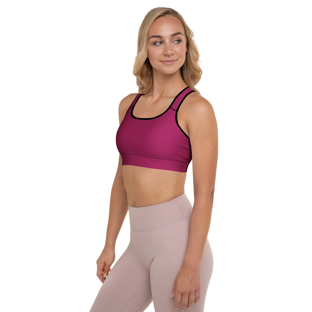Women’s burgundy padded sports bra in magenta with black trim, buttery soft, supportive, and quick-dry material
