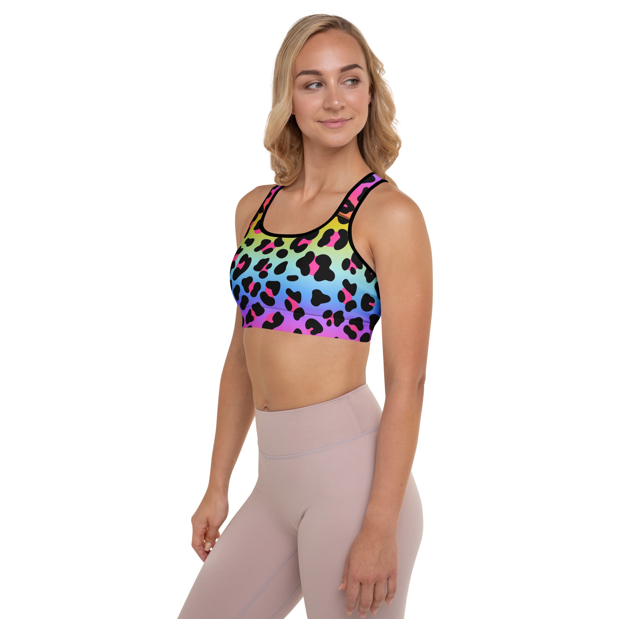 Women’s rainbow leopard padded sports bra with black and pink accents made of buttery soft, quick-dry fabric