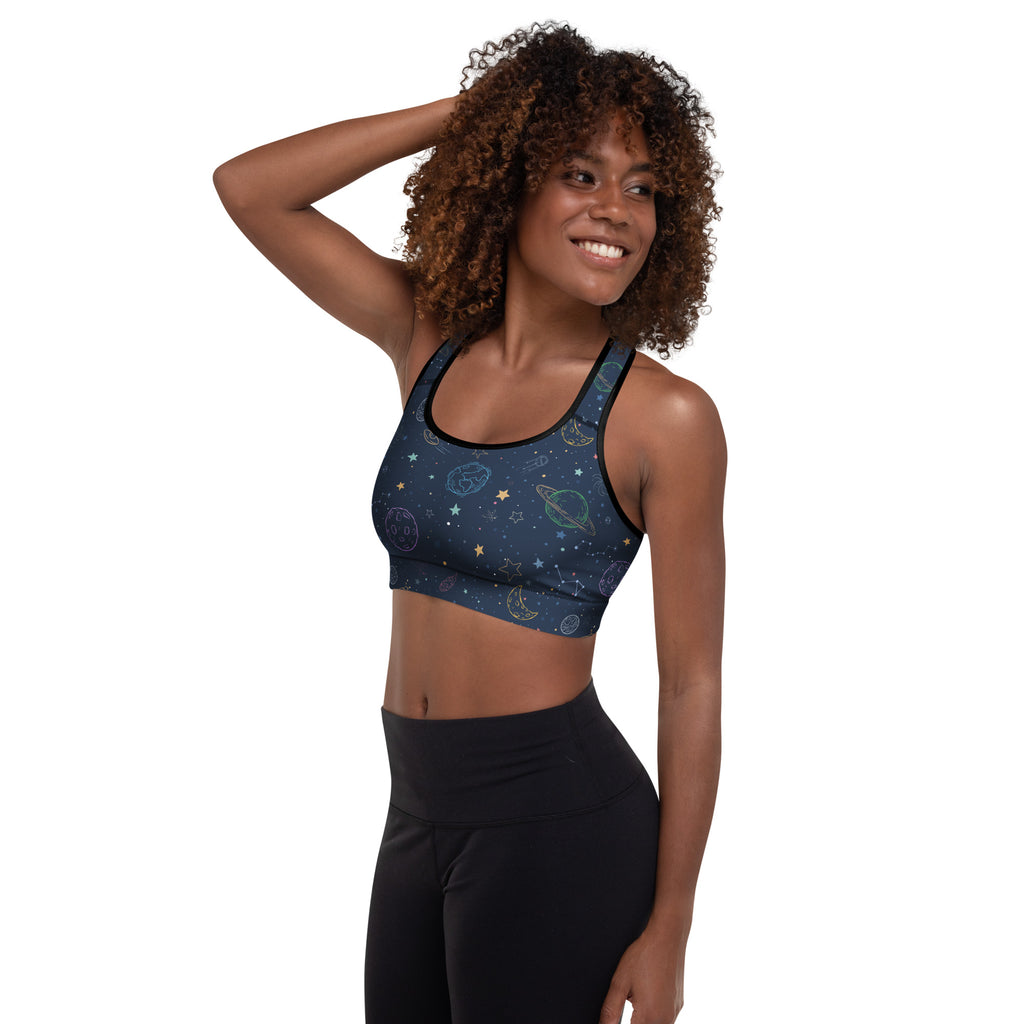 Navy blue padded sports bra with celestial planets stars and moons in light gold and white outlines buttery soft and quick-dry