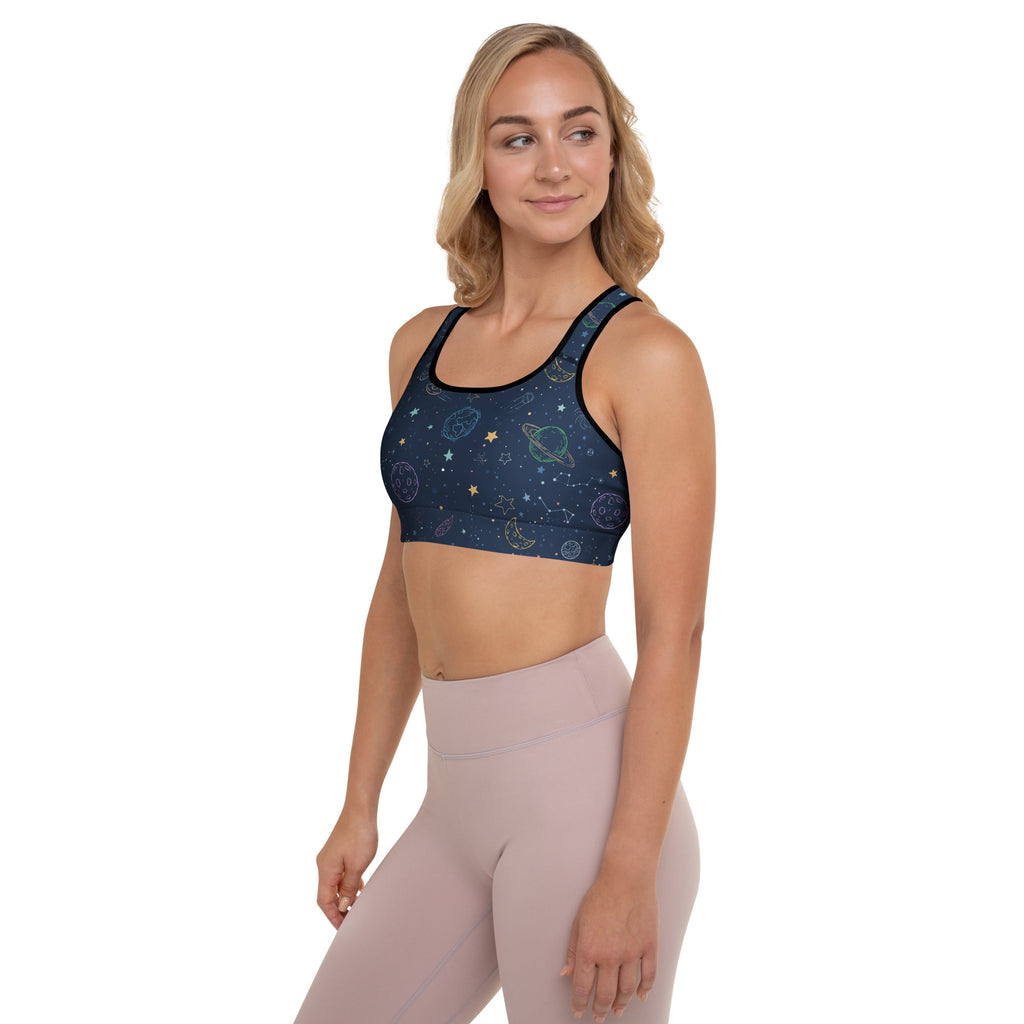 Navy blue womens padded sports bra with black trim and gold white celestial star moon planet pattern buttery soft and quick dry