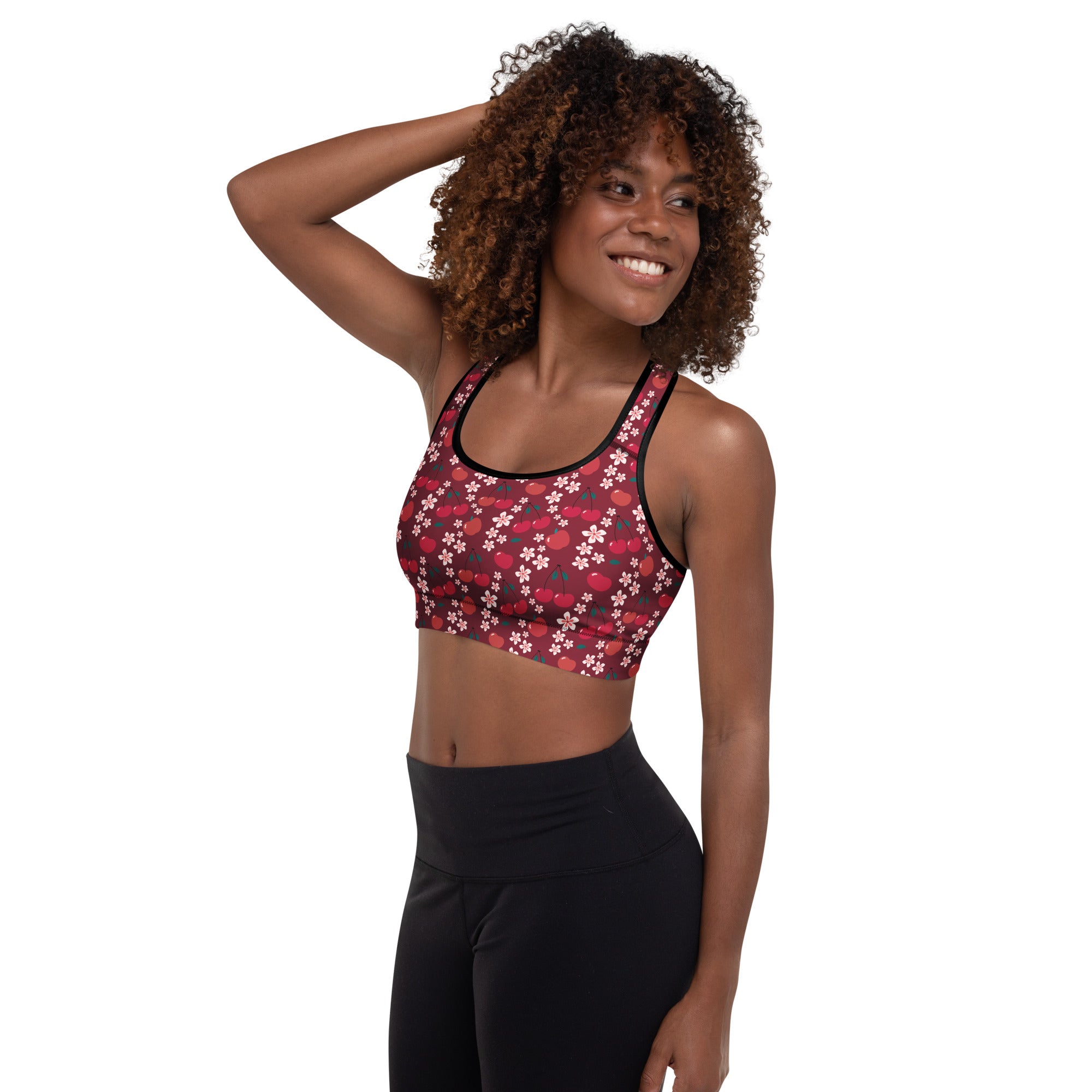 Women’s burgundy cherry blossom padded sports bra with vibrant red and white pattern, black trim, quick-dry fabric