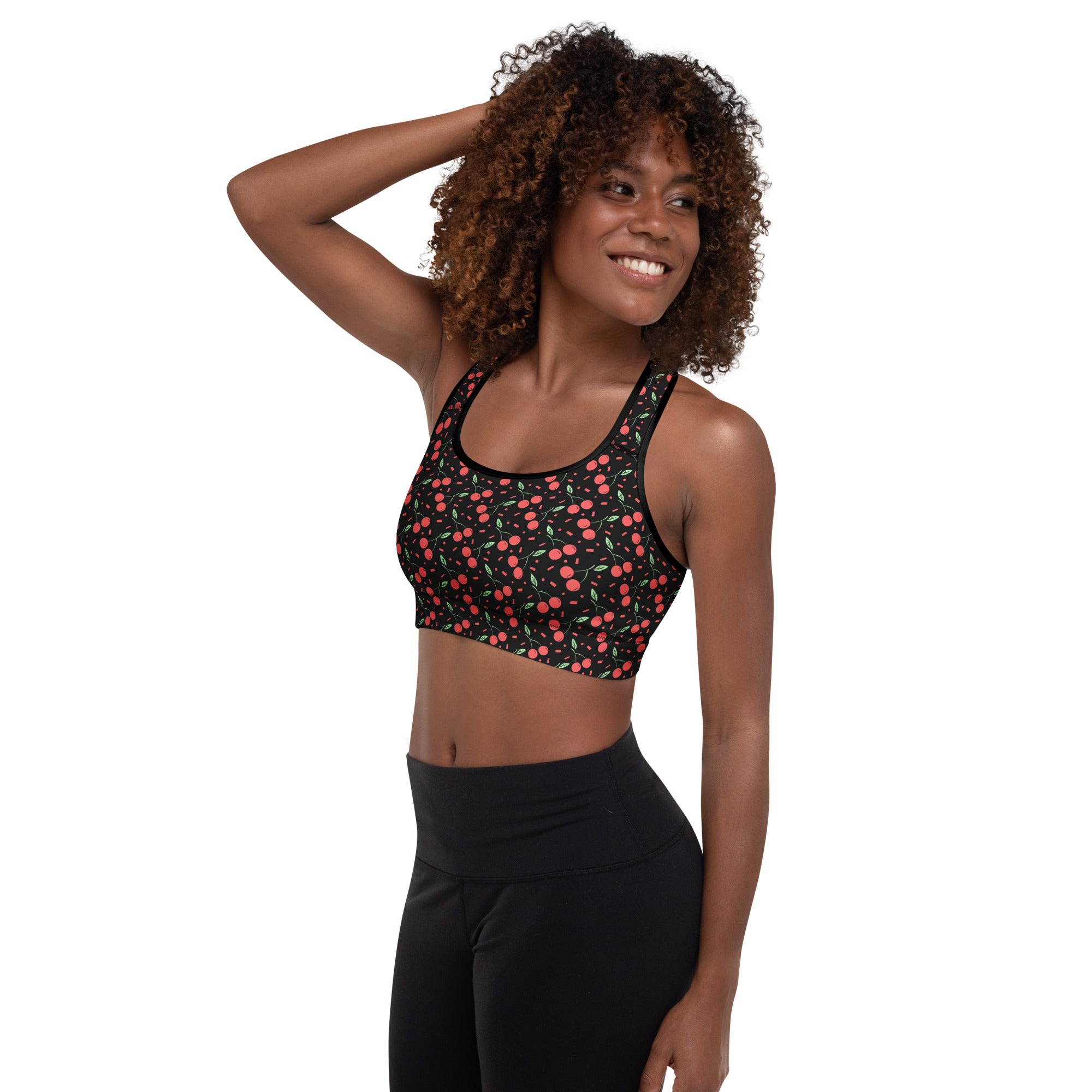 Women’s black padded sports bra with playful pink and green cherry print buttery soft supportive quick dry