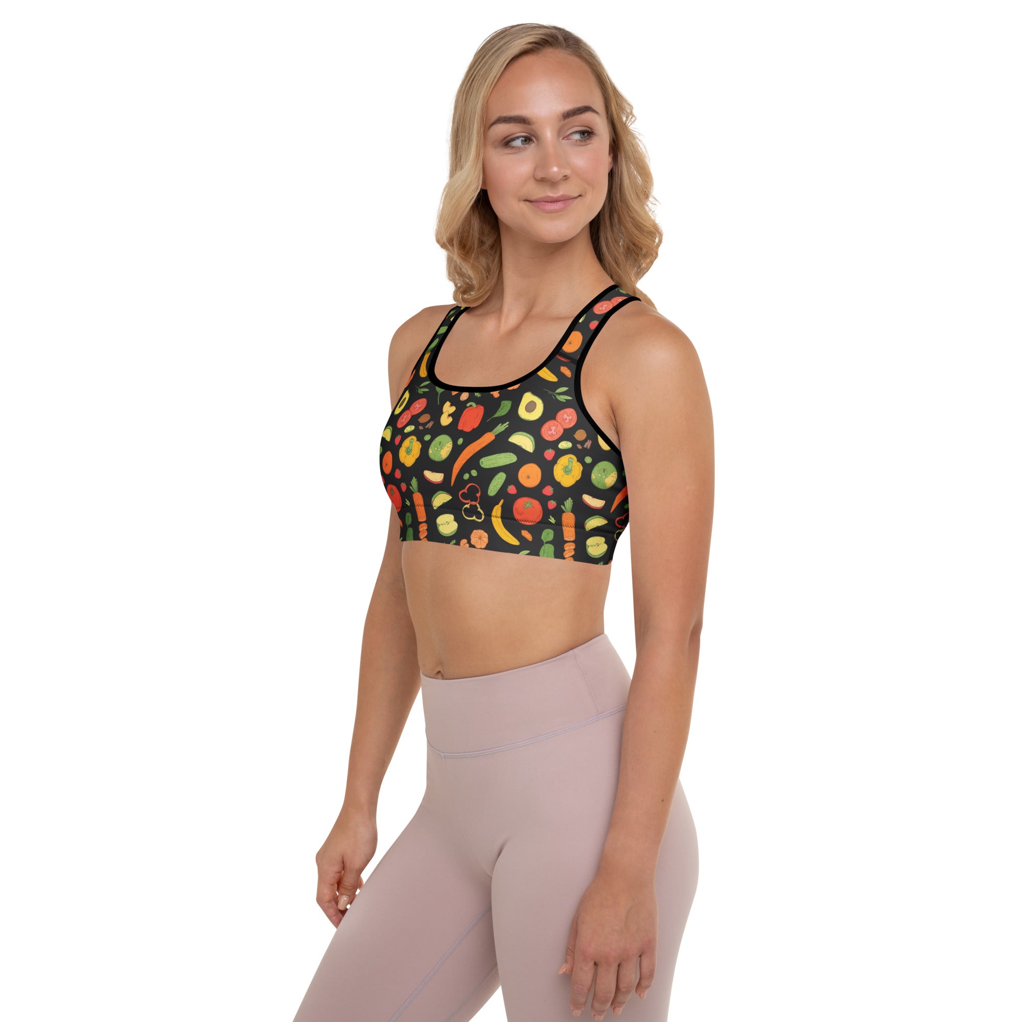 Black padded sports bra with vibrant fruit and vegetable print buttery soft supportive quick dry material