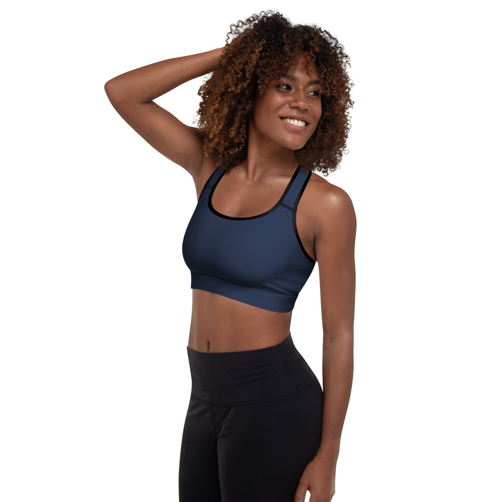 Women’s navy padded sports bra with black trim, buttery soft fabric, supportive fit, and quick-dry material